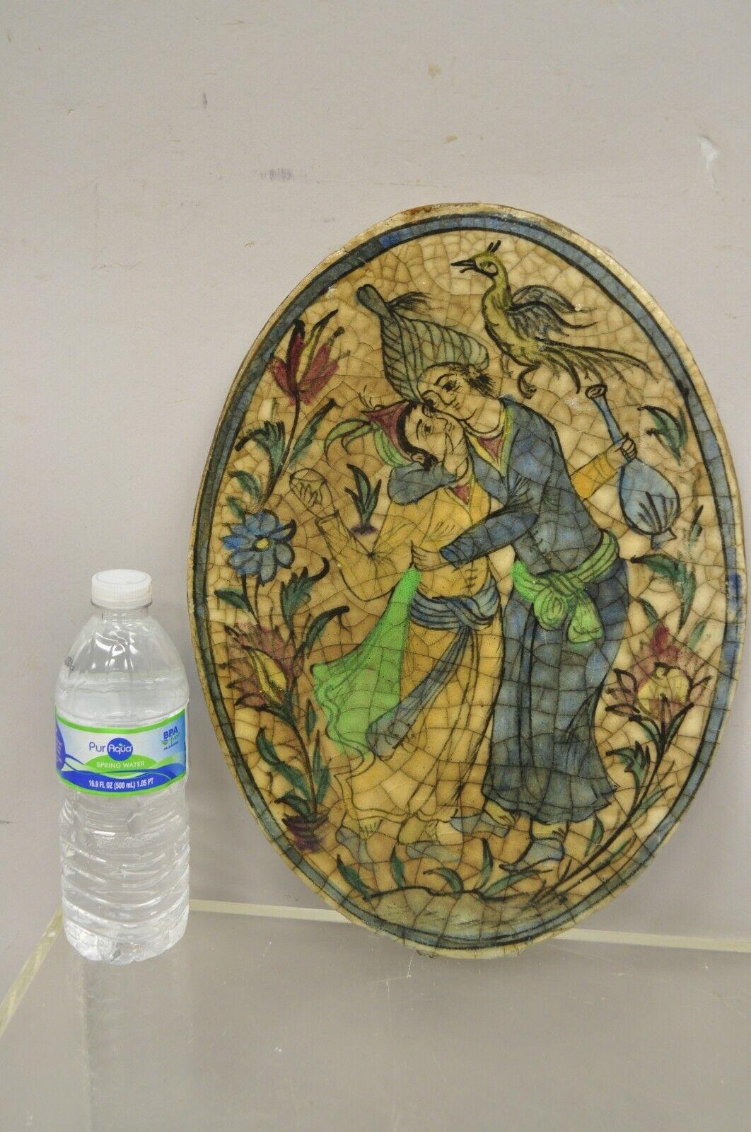 Antique Persian Iznik Qajar style oval ceramic pottery tile Loving Embrace C2. Original crackle glazed finish, heavy ceramic pottery construction, very impressive detail, wonderful style and form. Great to mount as wall art or accent tiles for
