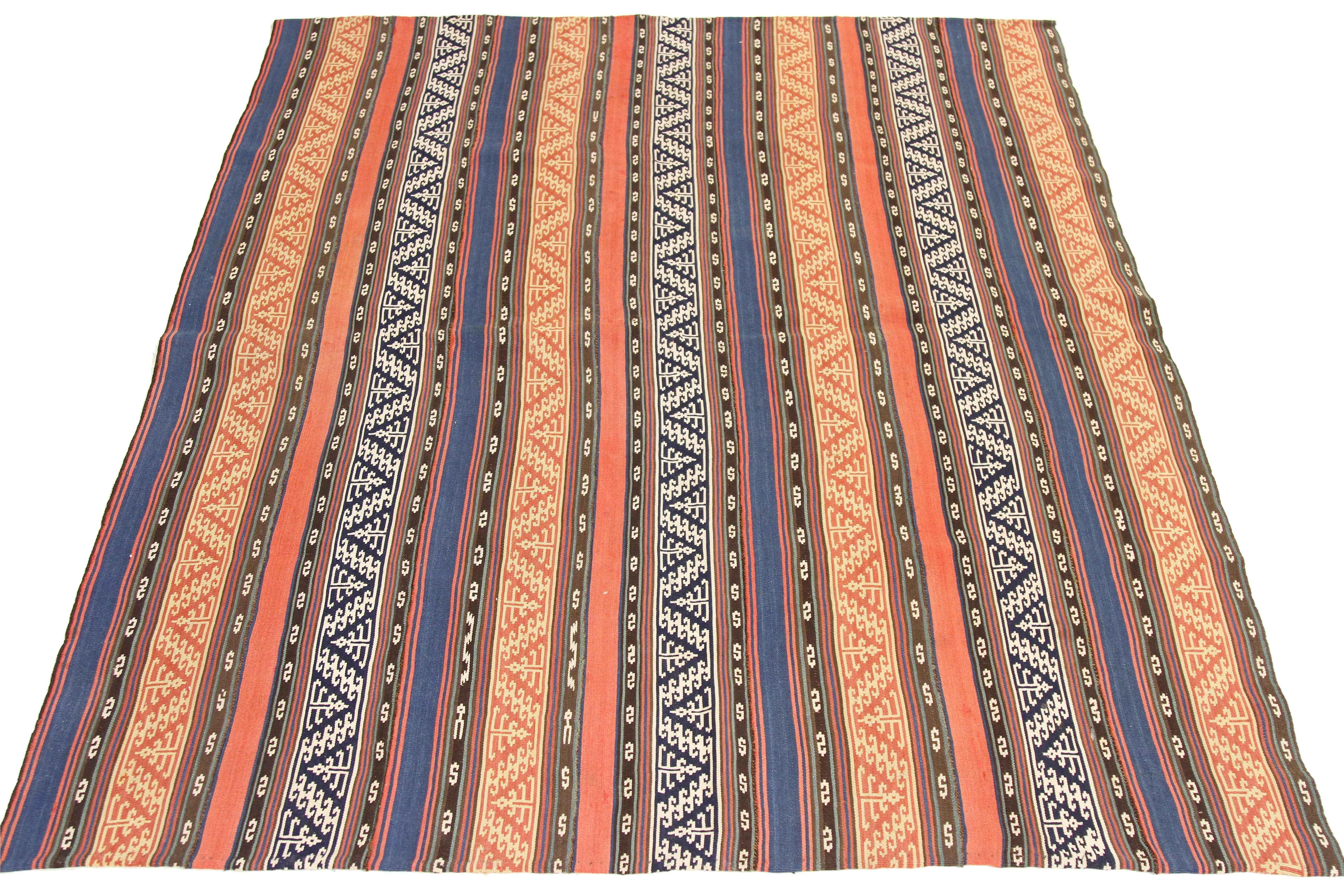 Antique Persian rug handwoven from the finest sheep’s wool and colored with all-natural vegetable dyes that are safe for humans and pets. It’s a traditional Jajim flat-weave design featuring blue and brown tribal stripes. It’s a stunning piece to
