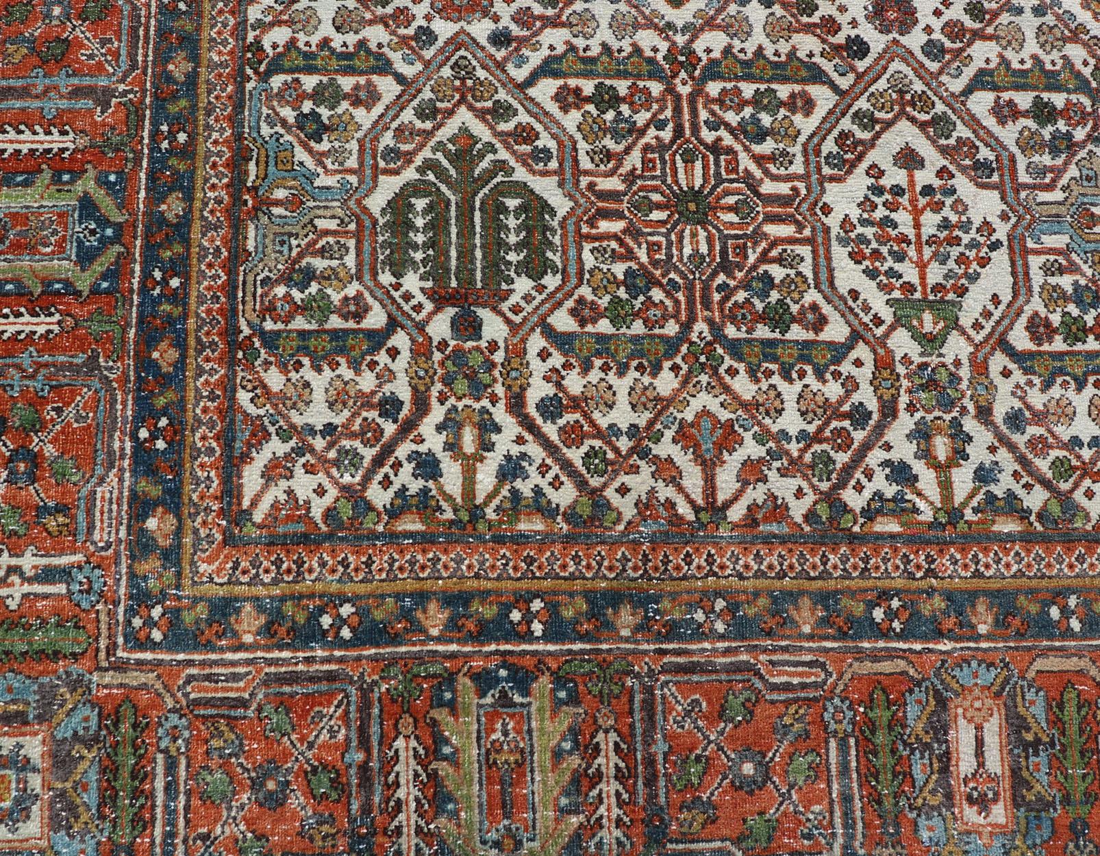 Tabriz Antique Persian Joshegan Rug in Ivory Background With Blue, Green, & Copper  For Sale