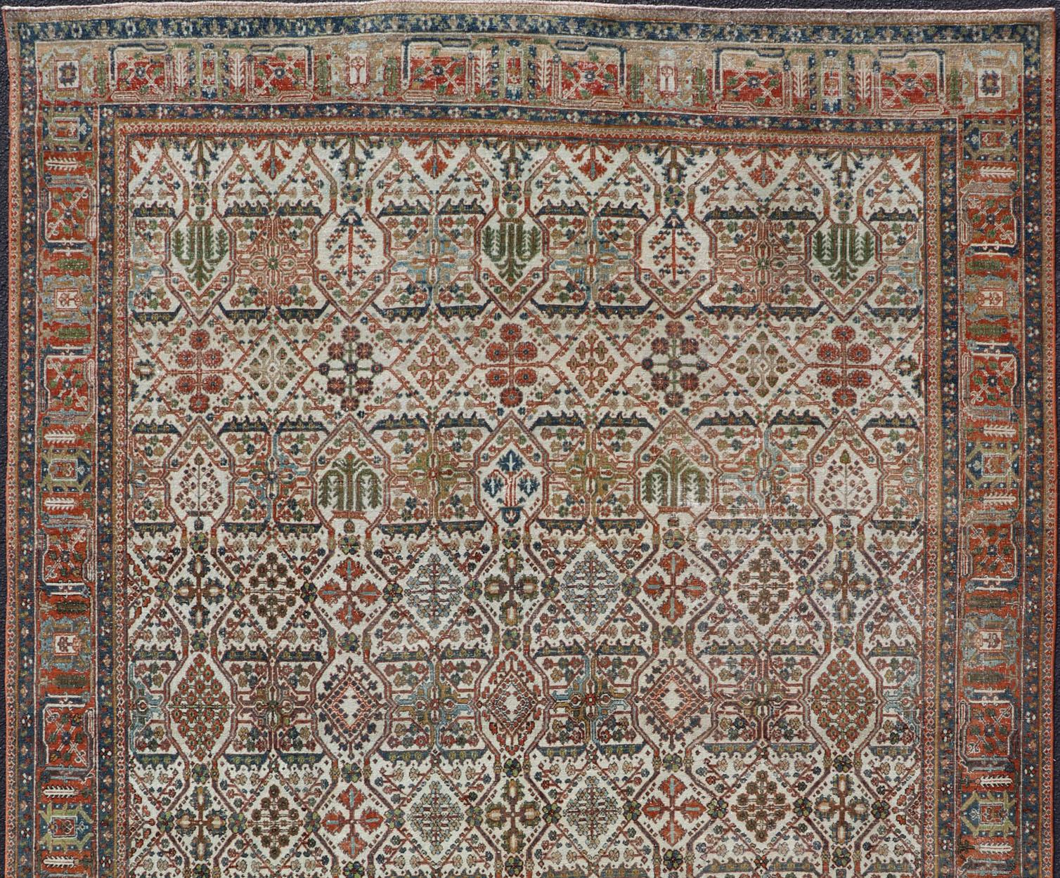 Antique Persian Joshegan Rug in Ivory Background With Blue, Green, & Copper  In Good Condition For Sale In Atlanta, GA