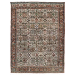 Tapis persan Joshegan ancien à fond ivoire avec des motifs bleus, verts et cuivre