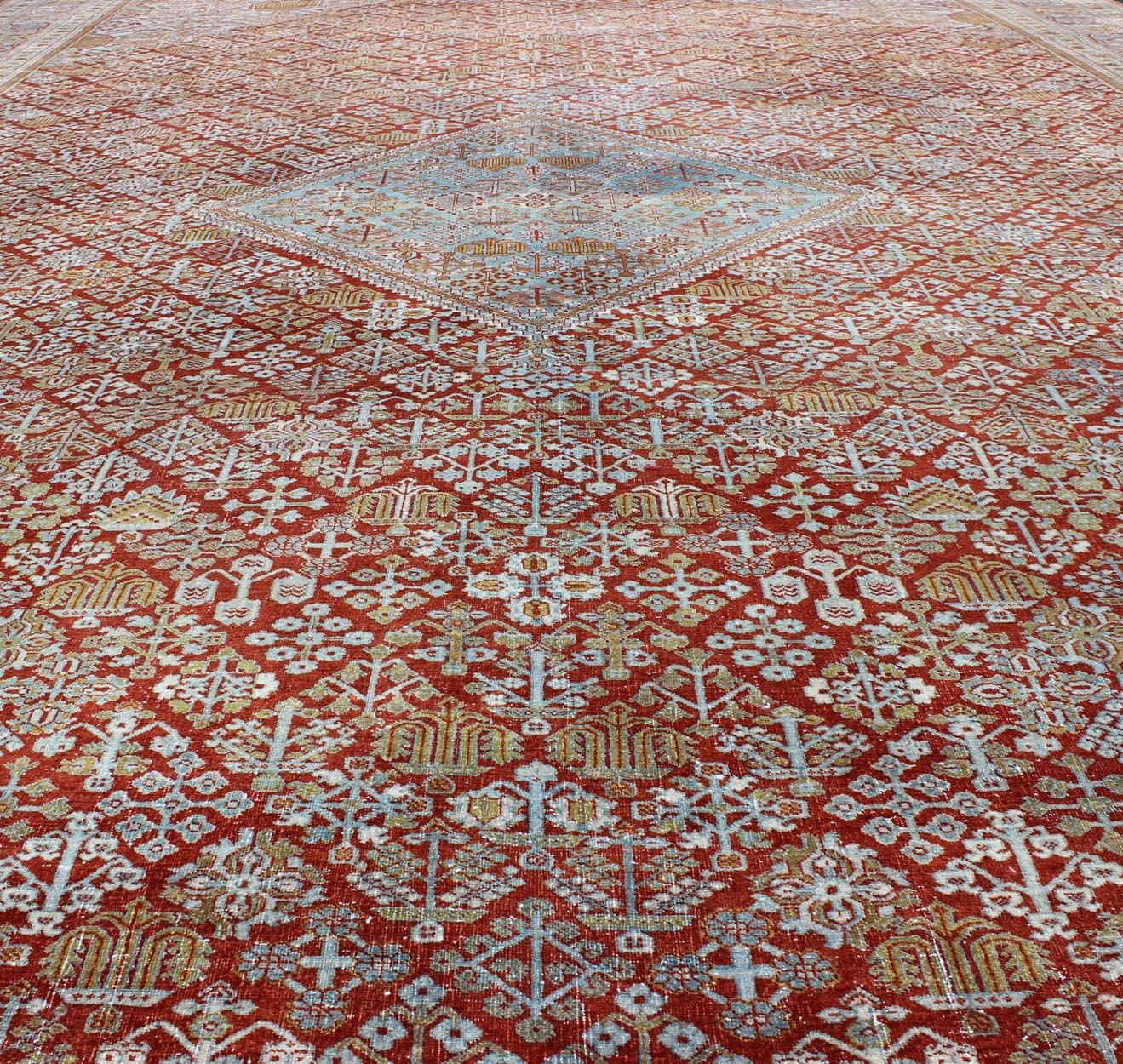 Early 20th Century Large Antique Persian Joshegan Rug in Rust Red, Light Blue, Green, Gold & Olive For Sale