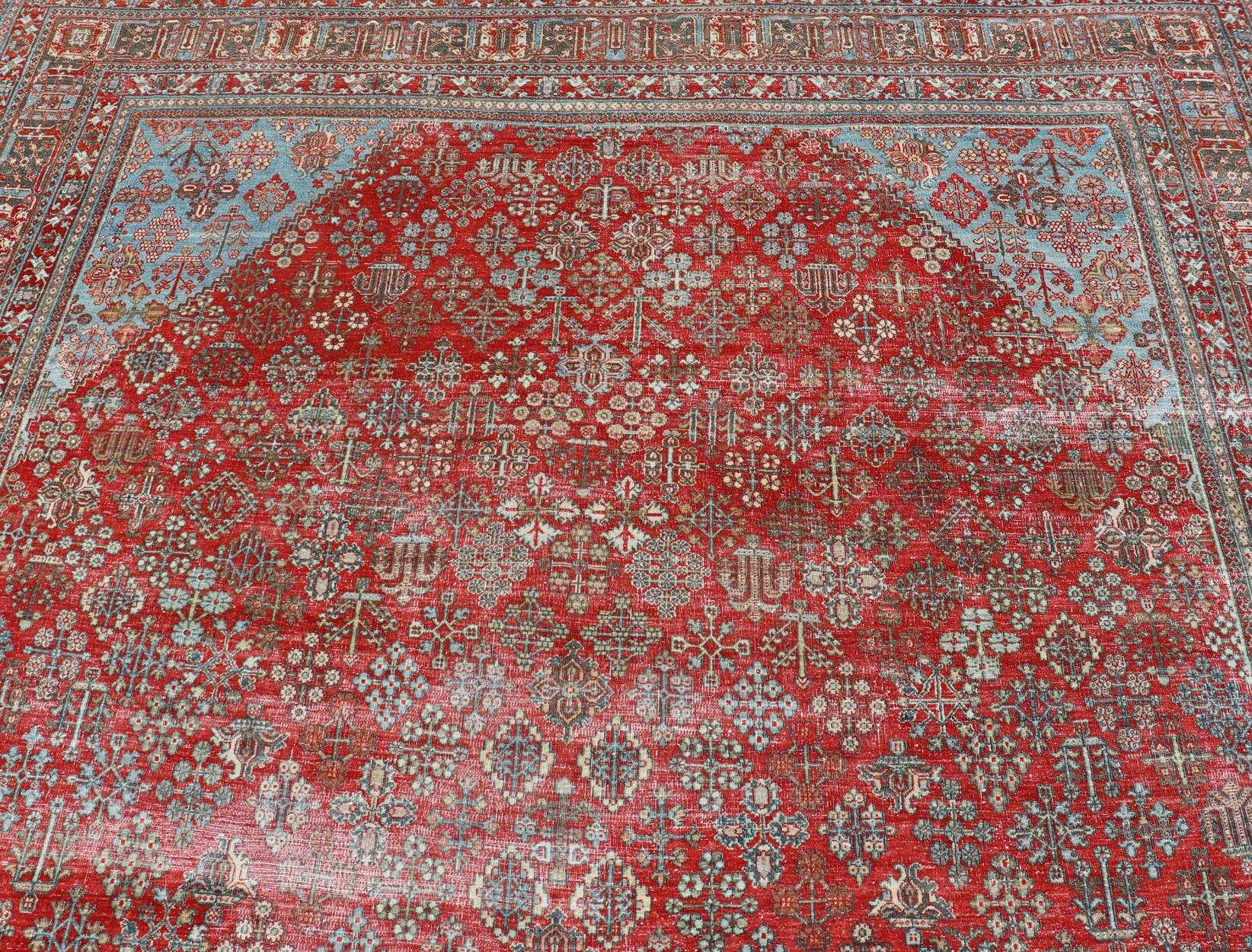 Antique Persian Joshegan rug with geometric medallion design in red and light blue, rug EMB-9613-P13524, country of origin / type: Iran / Joshegan, circa 1930

Measures: 9'6 x 12'3 

This antique Joshegan rug from 1930's was handwoven and bears