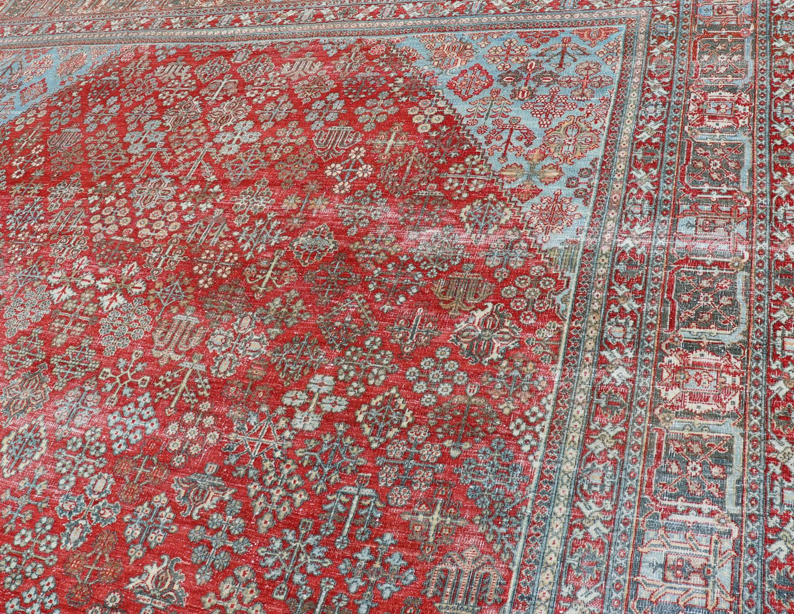 Wool Antique Persian Joshegan Rug with Geometric Medallion Design in Red and Lt. Blue For Sale