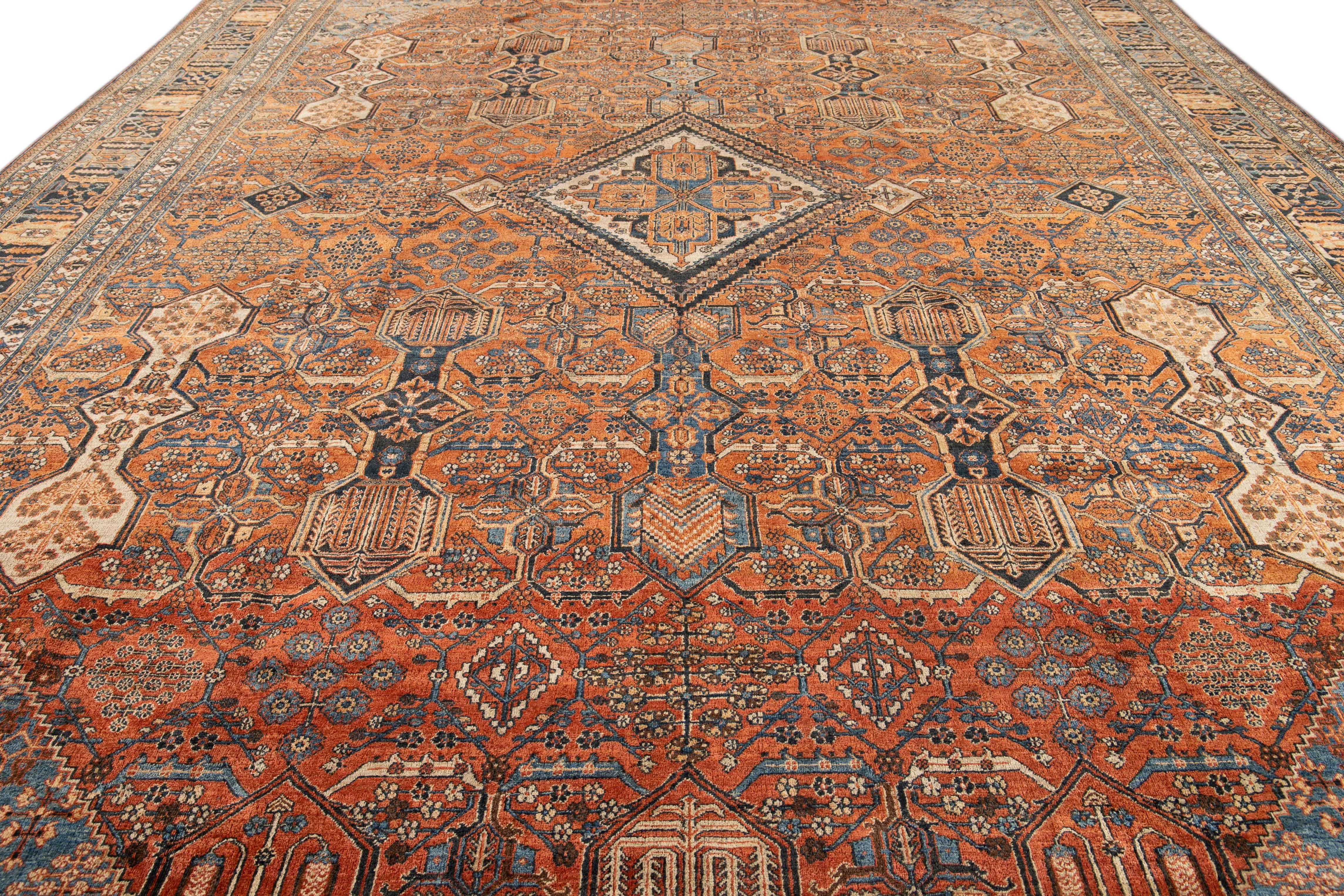 Islamic Antique Persian Josheghan Orange Handmade Oversize Wool Rug with Medallion Motif For Sale