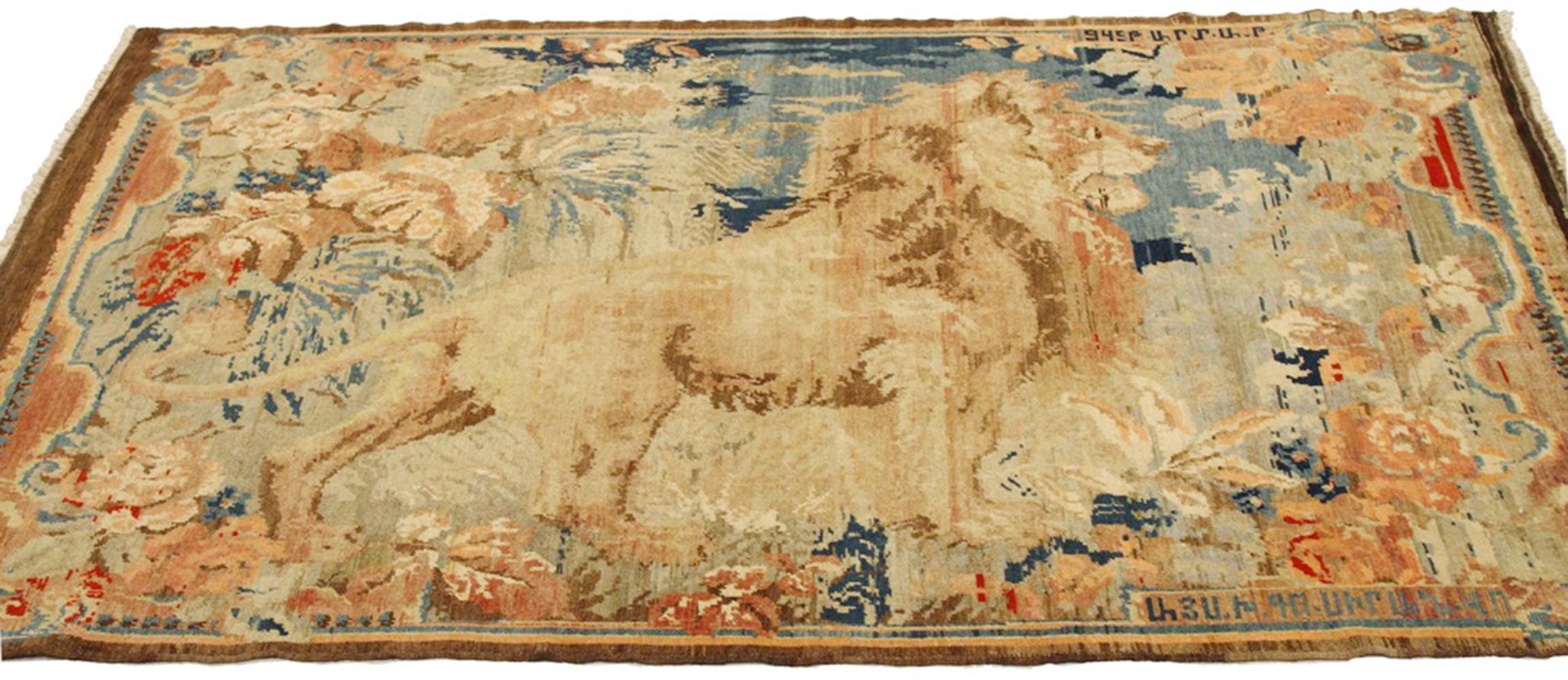 Antique Persian rug handwoven from the finest sheep’s wool and colored with all-natural vegetable dyes that are safe for humans and pets. It’s a traditional Karabagh design featuring a colorful lion figure over blue and pink field. It’s an elegant