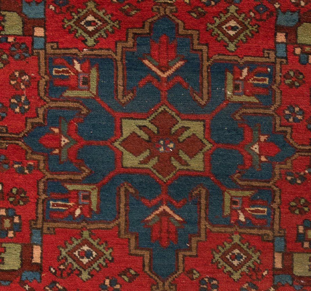 Antique Karaja (Black Mountain) rugs are woven in Iran near the Caucasian border and therefore exhibit Caucasian styles and motifs. This carpet measures 3.3 x 4.8 ft and is from c. 1920s