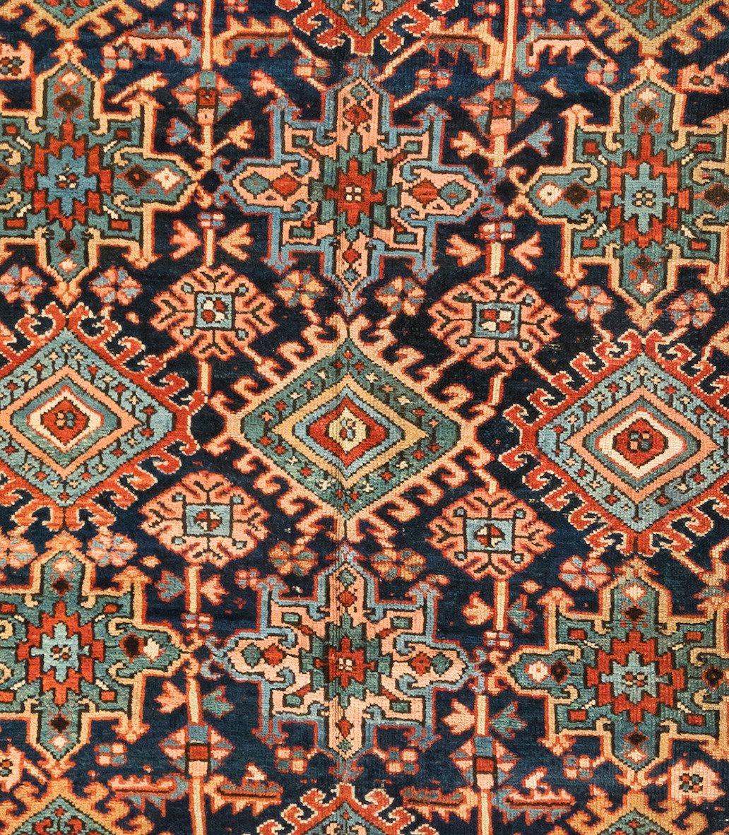 Antique Karaja (Black mountain) rugs are woven in Iran near the Caucasian border and therefore exhibit Caucasian styles and motifs. This lovely carpet measures: 7.7 x 10.11 ft. and is from 1920s.