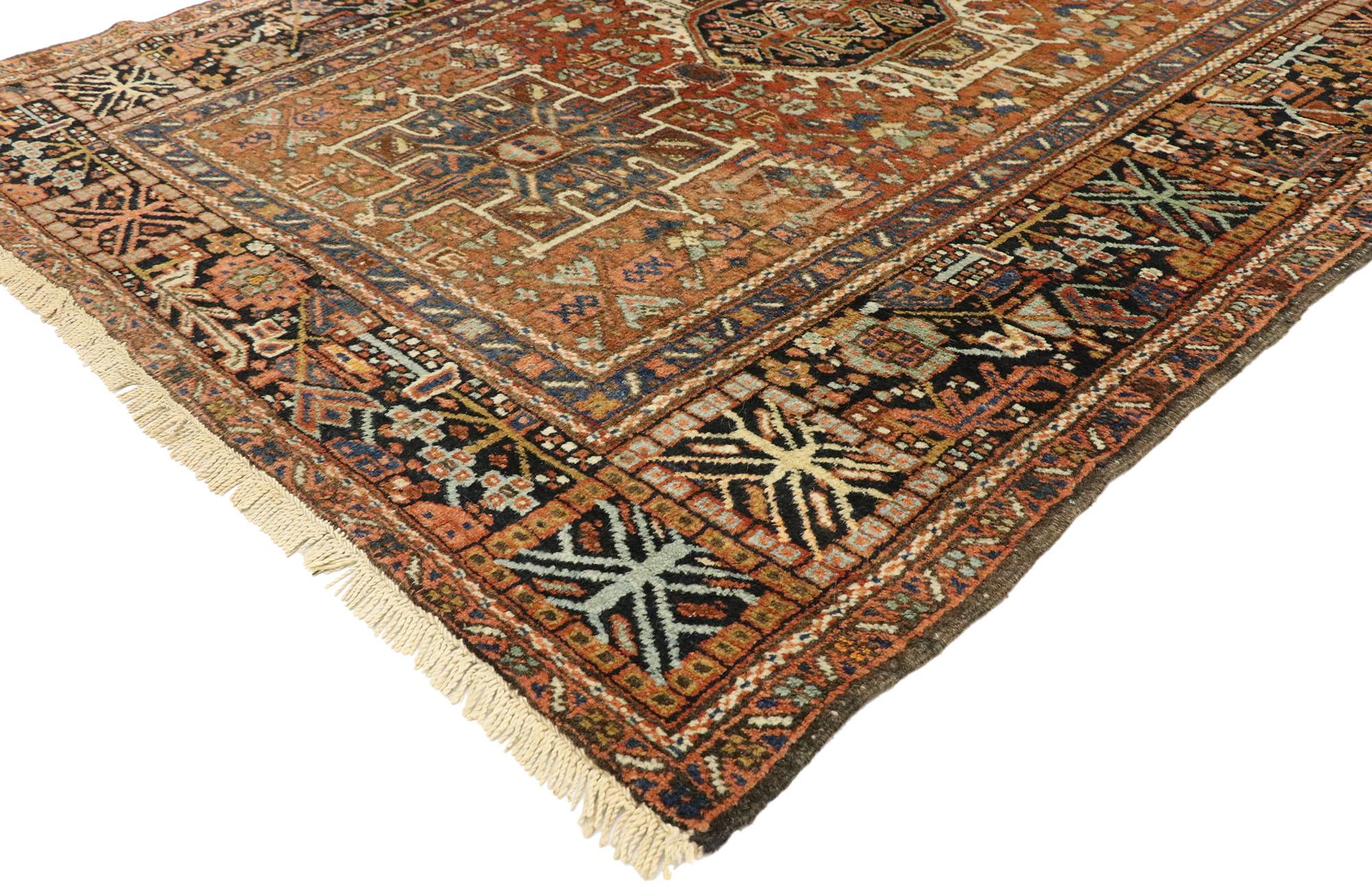 77067 antique Persian Karaja Heriz rug with Tribal style, Study or Home Office rug. This hand knotted wool antique Persian Karaja Heriz rug features three medallions with cruciform motifs. The central scarab shaped medallion is flanked by two square