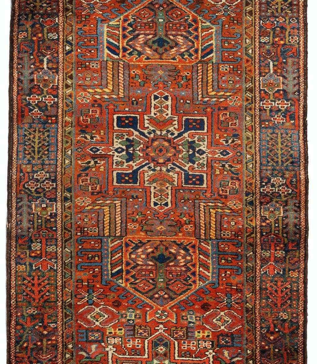Antique Karaja (Black Mountain) rugs are woven in Iran near the Caucasian border and therefore exhibit Caucasian styles and motifs, circa 1930-1940s. This beautiful runner measures 3.4 x 14.4 ft.