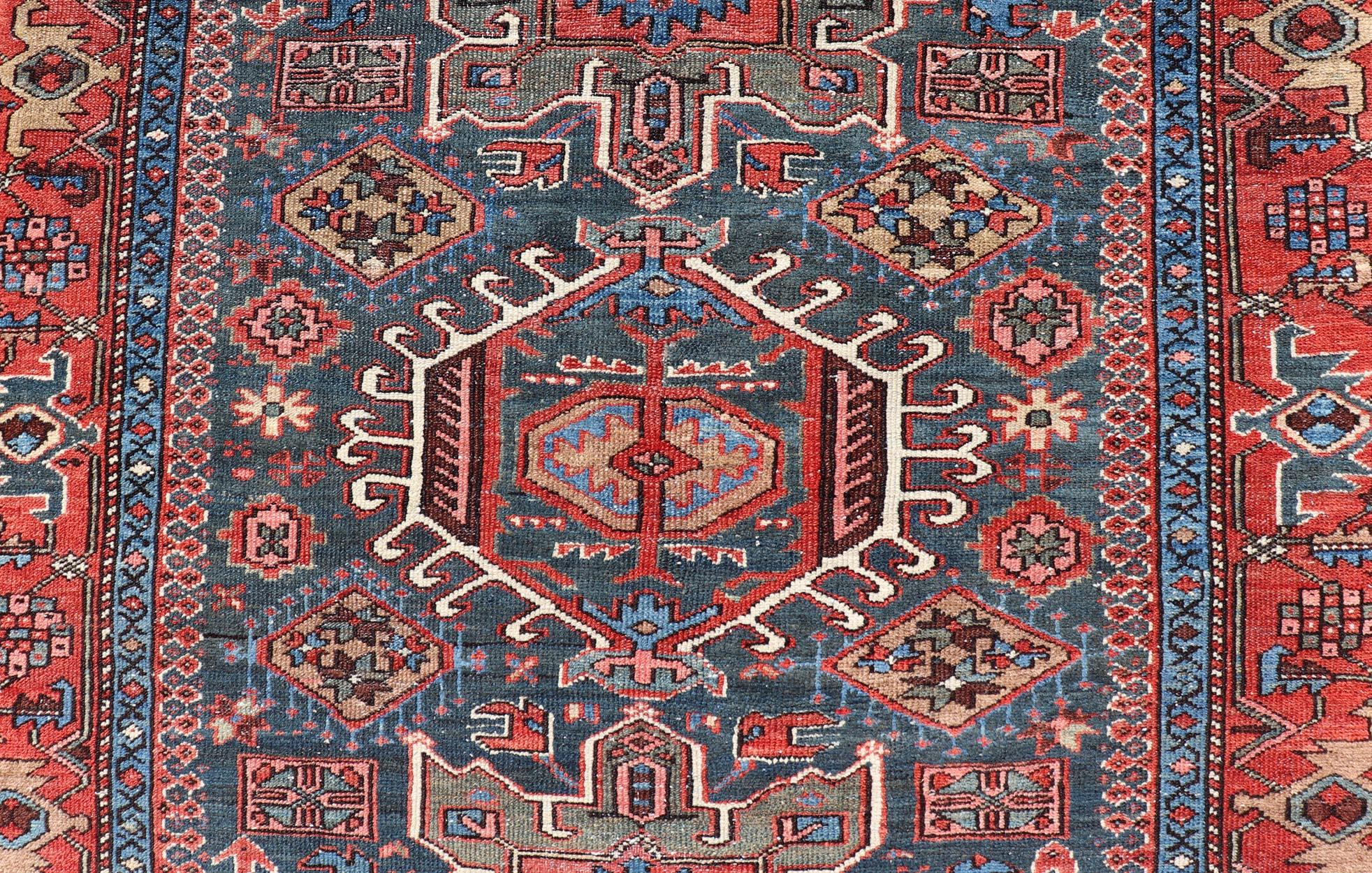 Antique Persian Karajeh Rug with Three Geometric Medallions in Red & Blue. Keivan Woven Arts / rug EMB-22109-15037, country of origin / type: Persian / Serapi-Karajeh, circa early-20th century.
Measures: 4'5 x 6'1 
Traditionally inspired by the