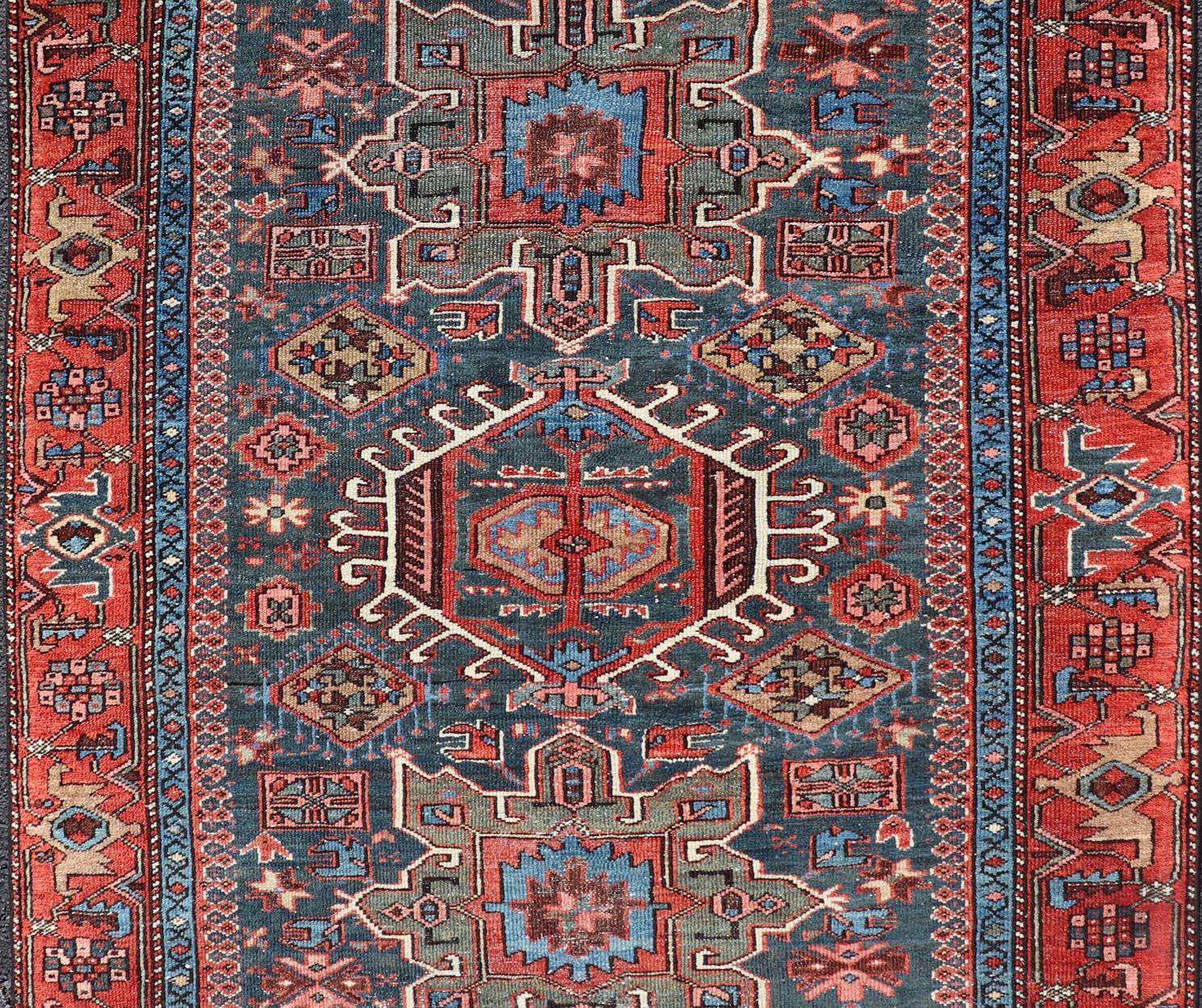 20th Century Antique Persian Karajeh Rug with Three Geometric Medallions in Red & Blue For Sale