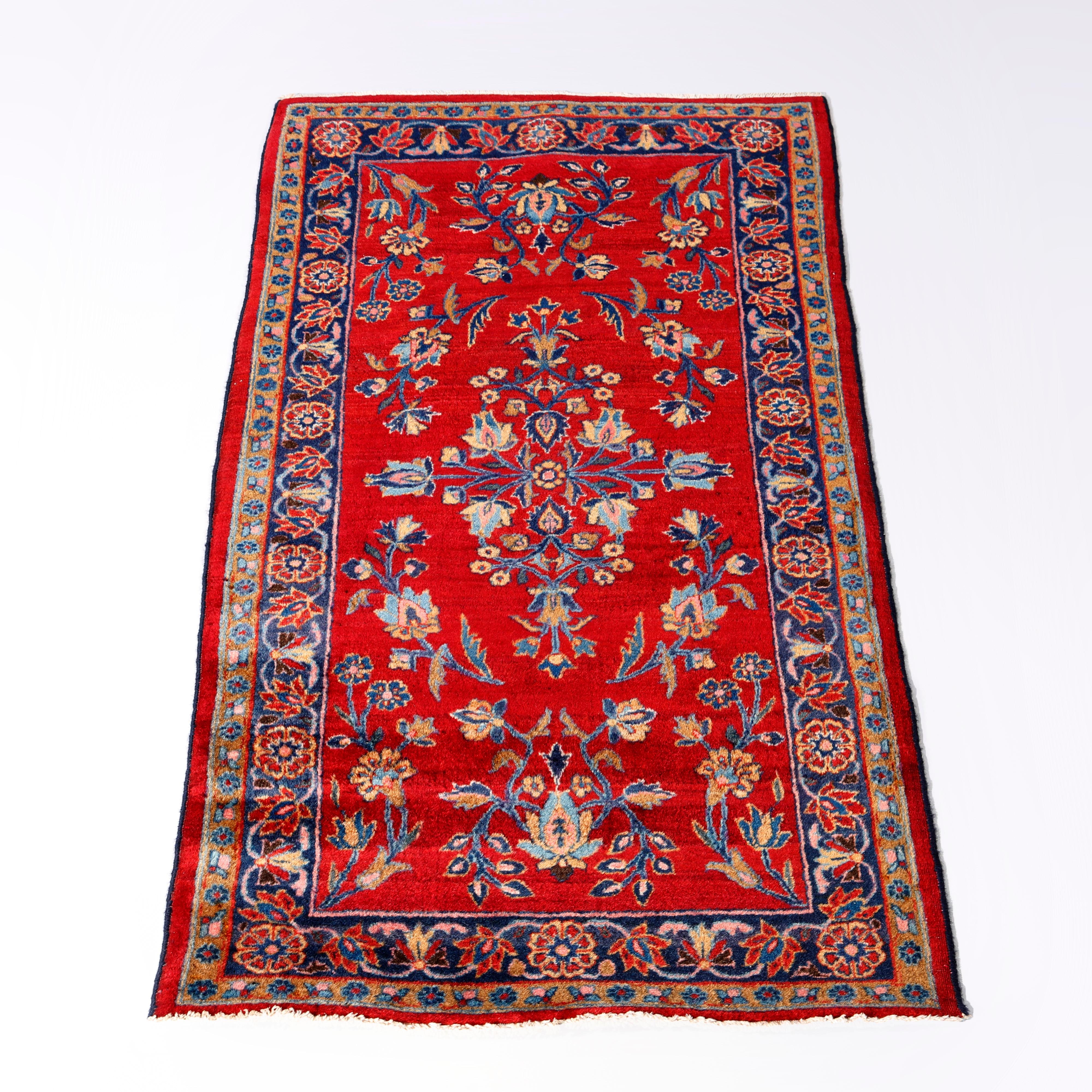 An antique Persian Kashan oriental rug offers wool construction with foliate and floral elements on a red ground, c1930

Measures - 48.5''L x 26.5''W x .5''D.

Catalogue Note: Ask about DISCOUNTED DELIVERY RATES available to most regions within