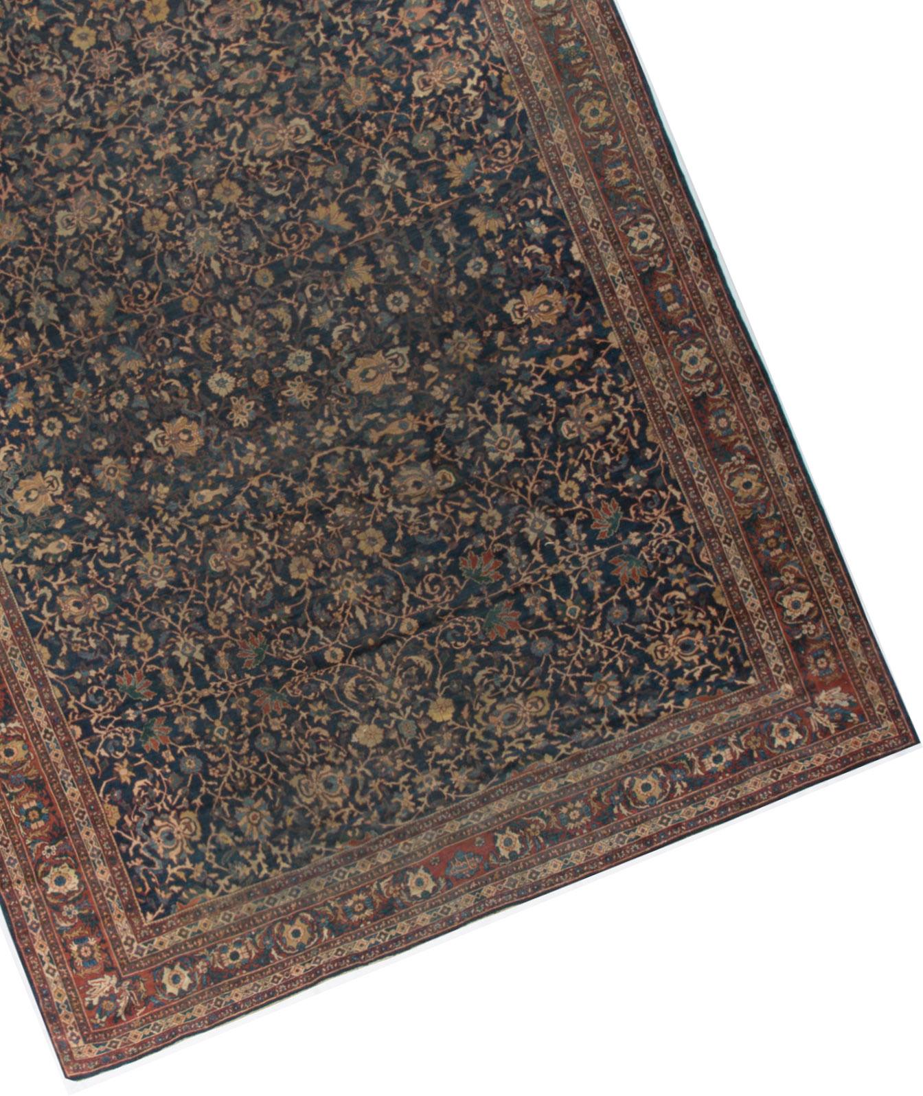 Antique Persian Kashan rug, circa 1900 with a magnificent allover arabesque design coupled with the simple and more spacious main border helps create an antique rug that will bring a sense of style and importance to any room setting. Size:12'3 x