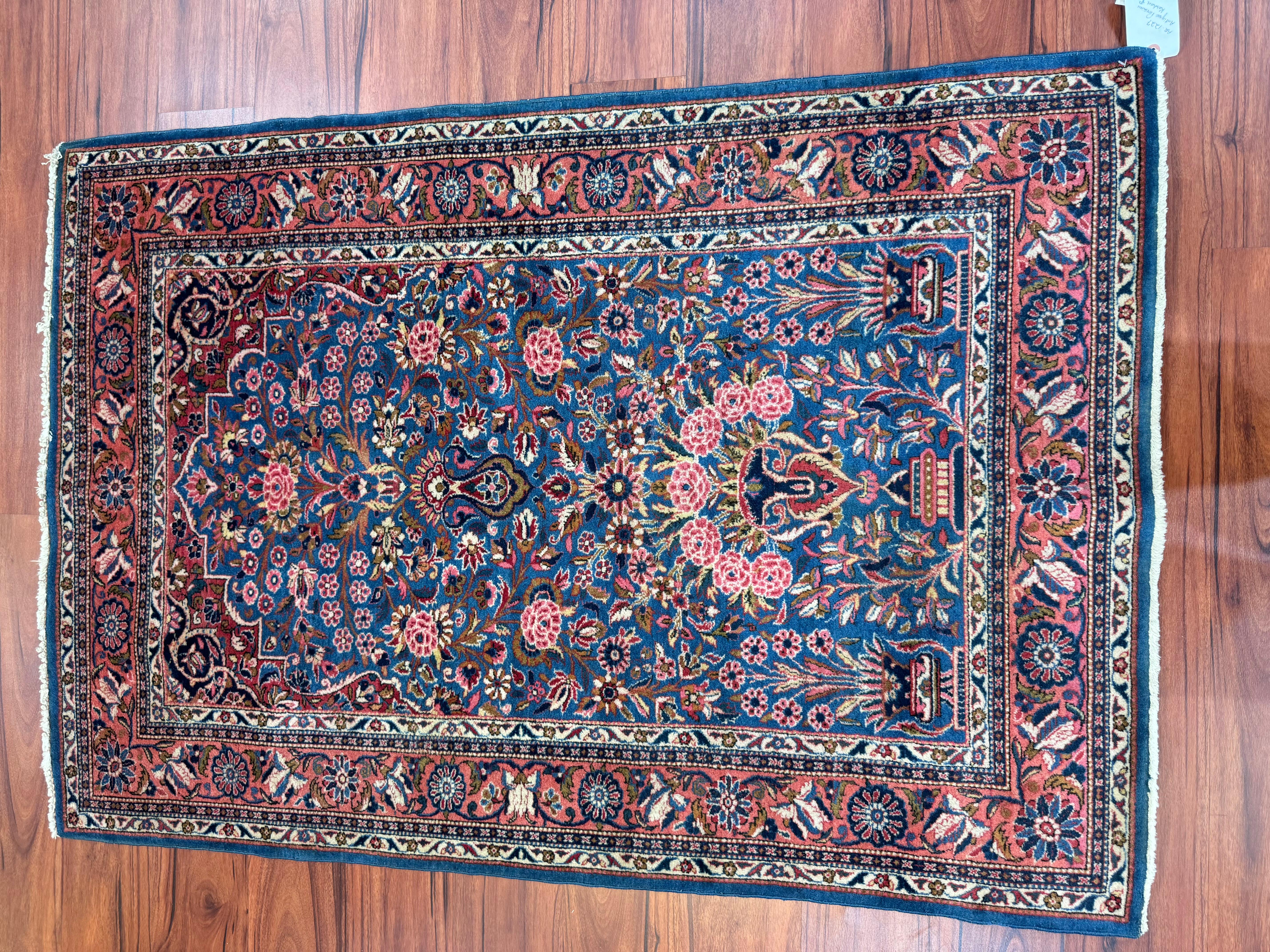 A stunning antique persian kashan rug that originates from Iran in the early 20th century. This piece is in excellent condition considering its rich history and has beautiful colors. Feel free to message me in regards to this listing or any other