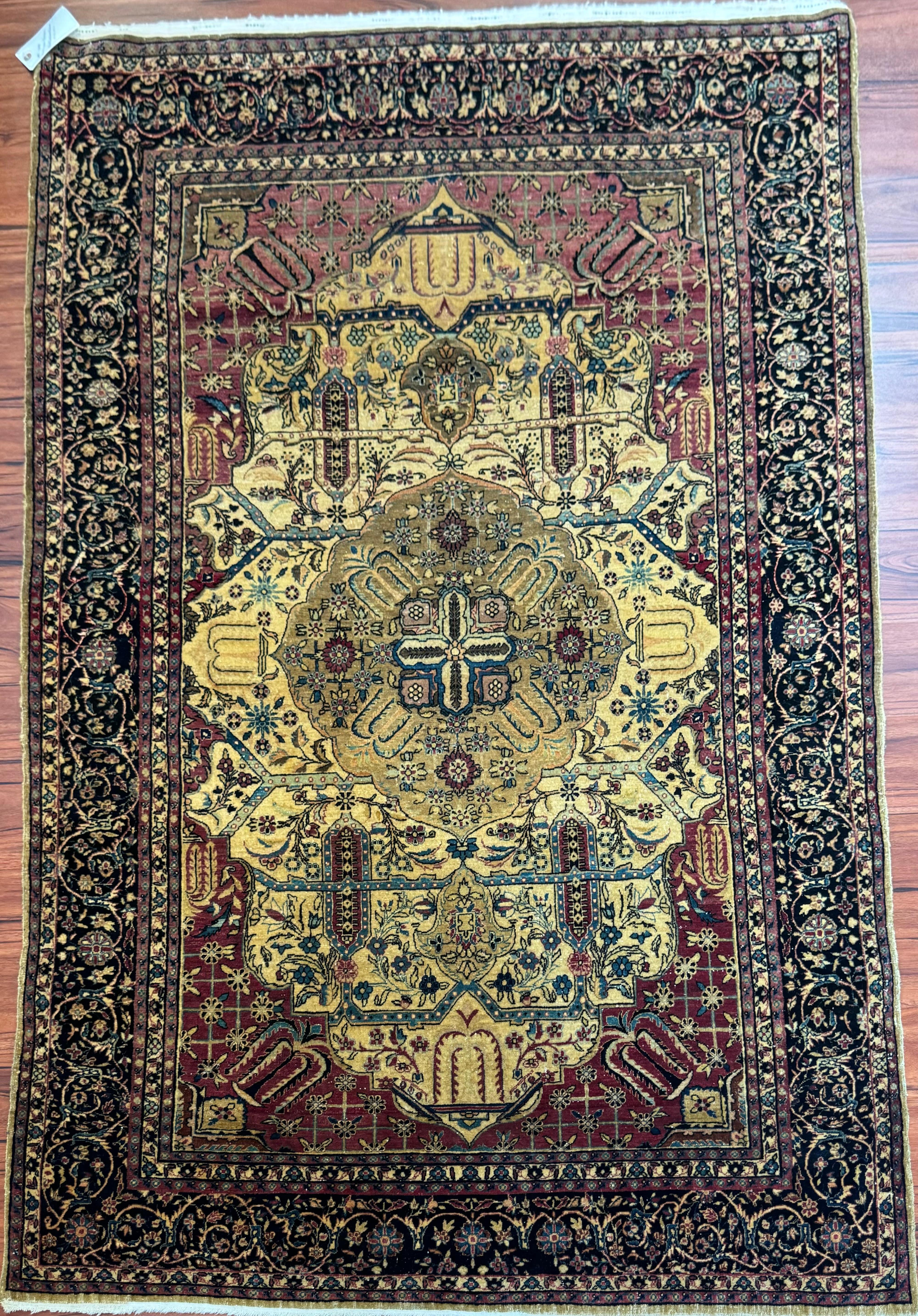 A stunning Antique Persian Kashan Rug that originates from Iran from the early 1900s. This rug is in near excellent condition considering its rich history and is truly gorgeous!