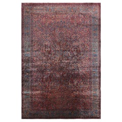Tapis persan Kashan ancien avec motifs floraux rouge-bleu