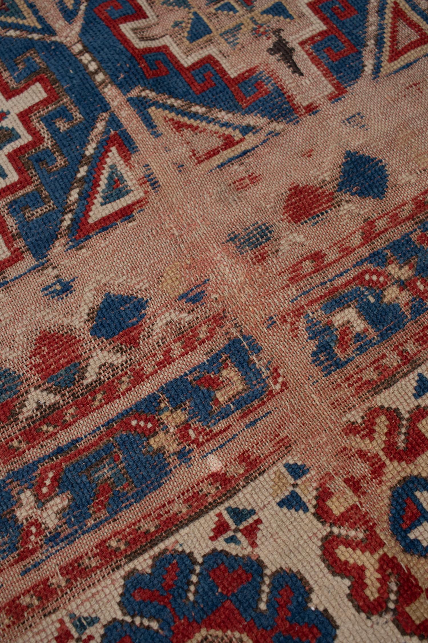 Wool on wool foundation antique Kazak woven in the late 1800's. Naturally worn to perfection, this rug will have the borders repaired before shipment. 
 
Wear Notes: 4 

Wear Guide:
Wear Notes: 4

Wear Guide:
Vintage and antique rugs are by