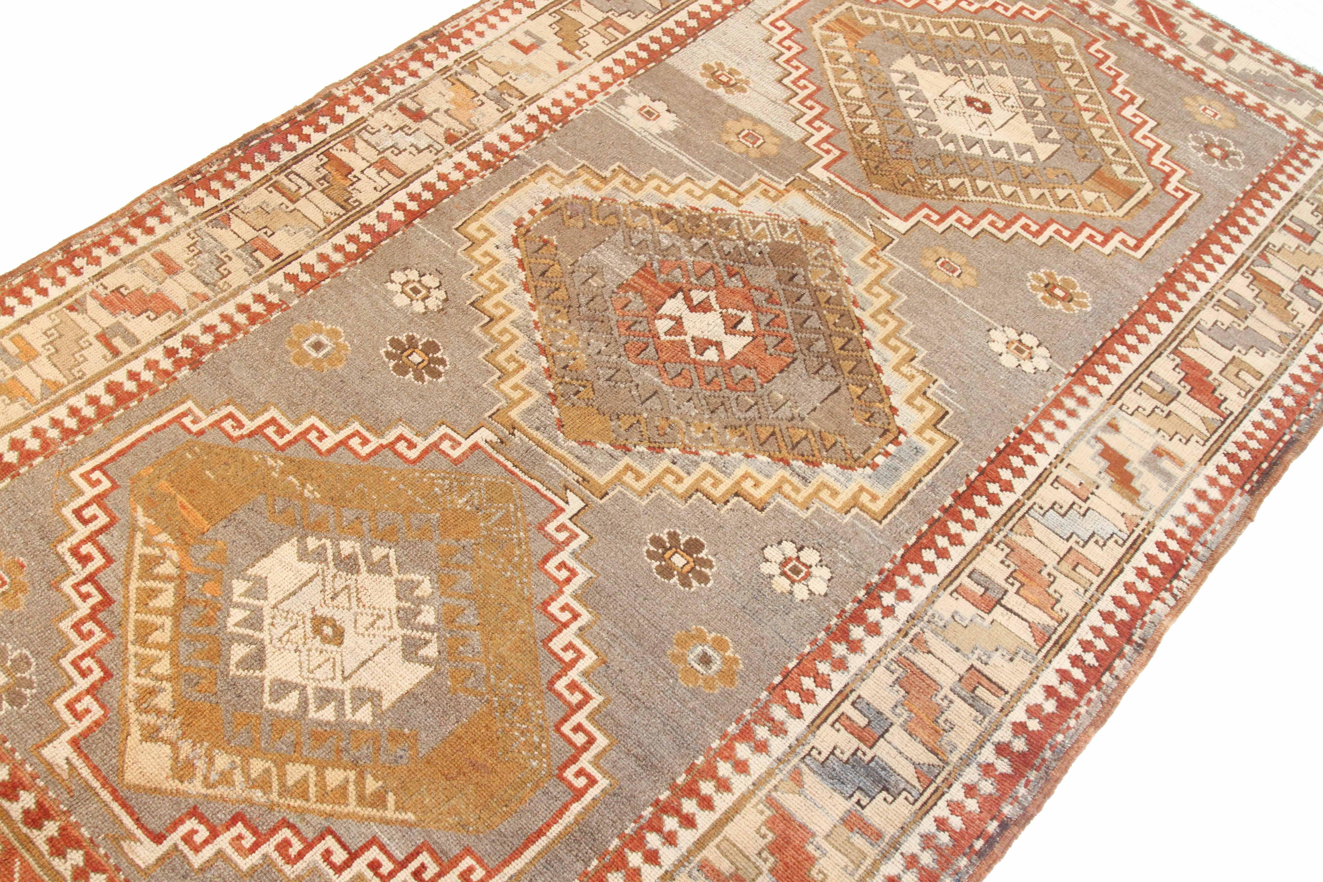 Hand-Woven Antique Persian Kazak Style Rug with Brown and Red Tribal Medallions For Sale