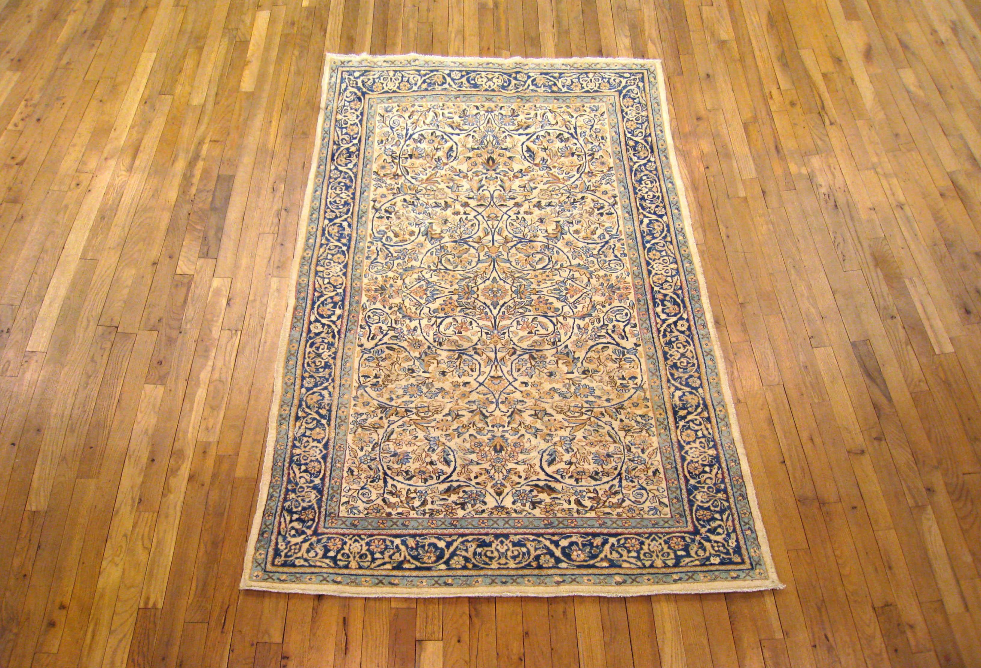 An antique Persian Kerman carpet from Persian Gallery New York, size 7'0