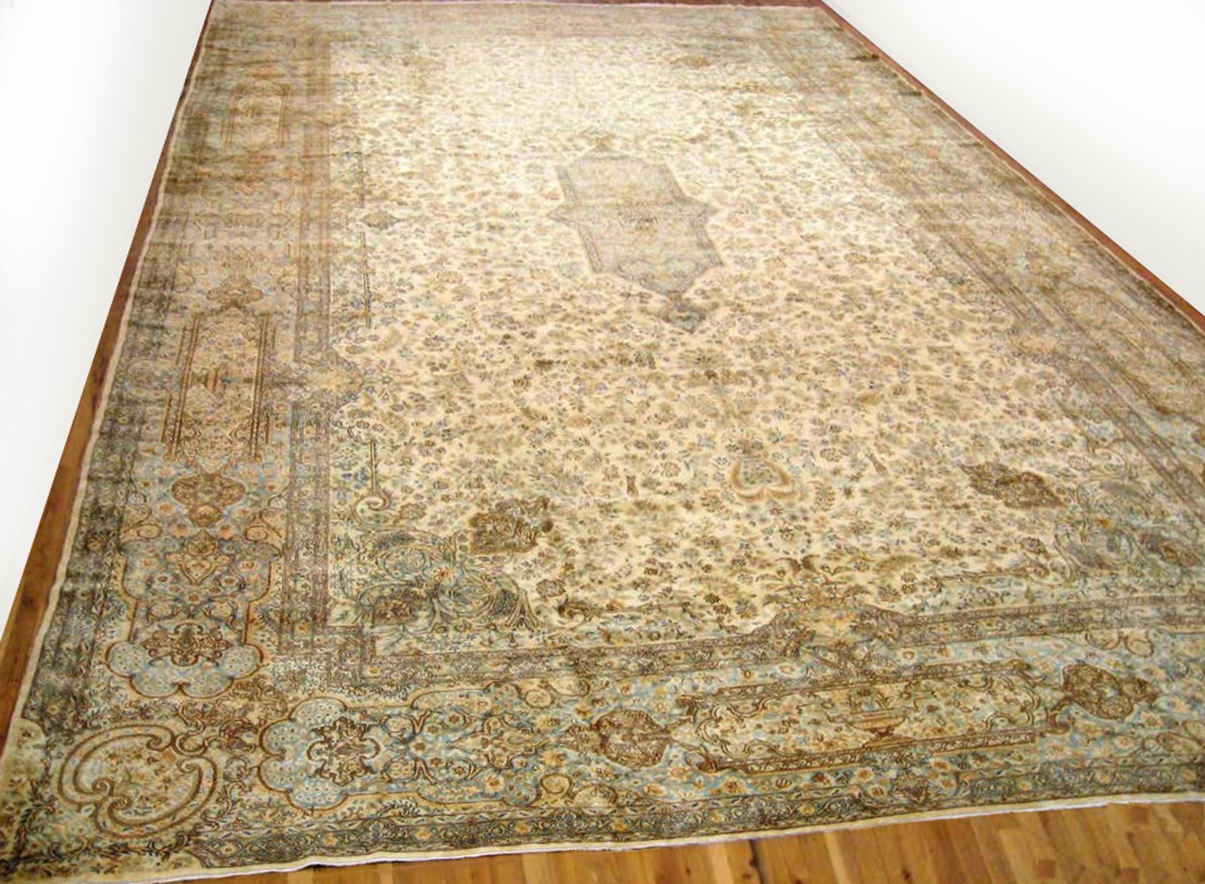 An elegant oversize antique Persian Kerman carpet, circa 1920, size 23'8