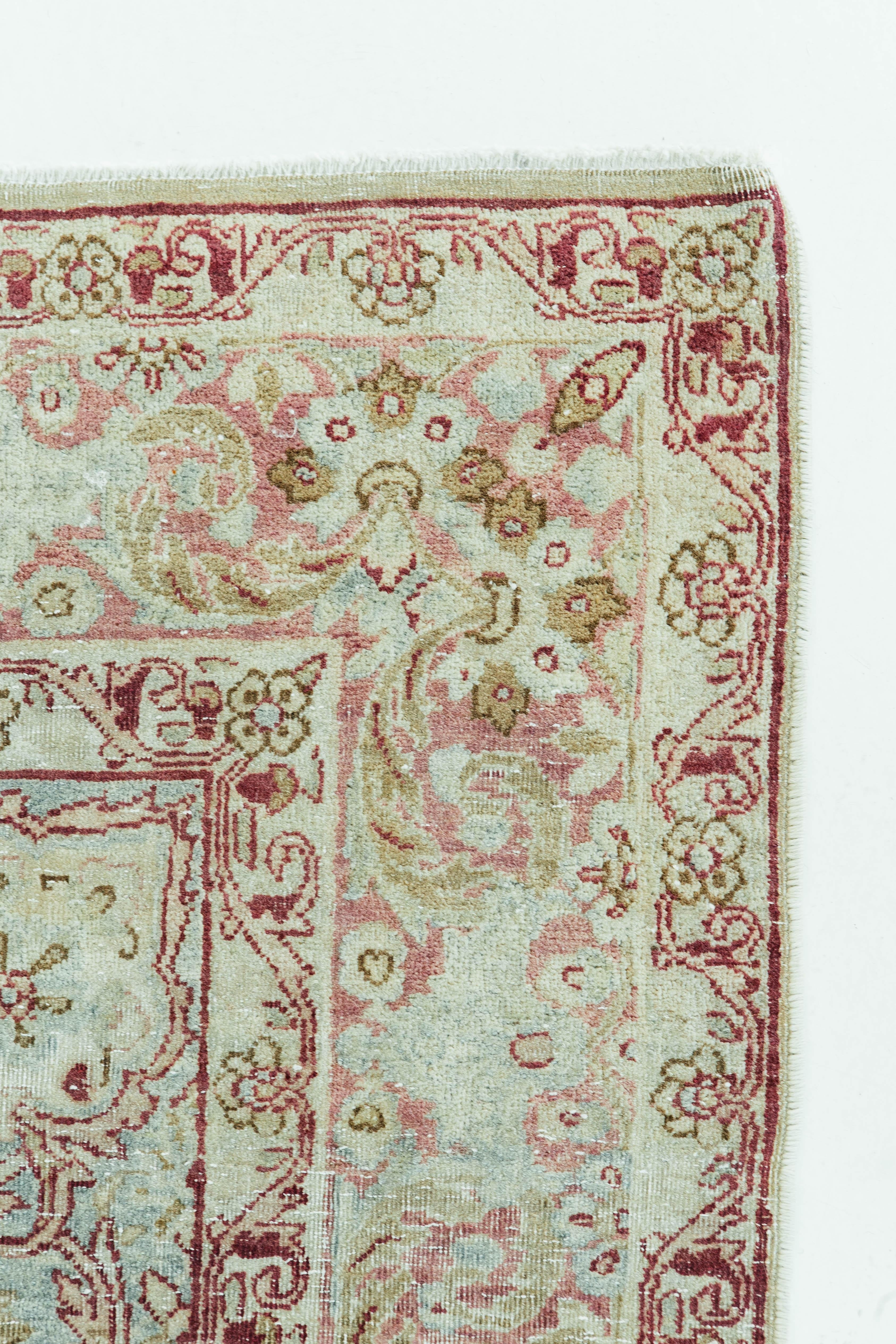 This antique Persian Kerman has a combination of soft hues yet vibrant colors that bring out the rug's Classic design. Its interesting vintage texture and color ways keep the eye engaged and brings a luxurious essence. The city of Kerman is situated