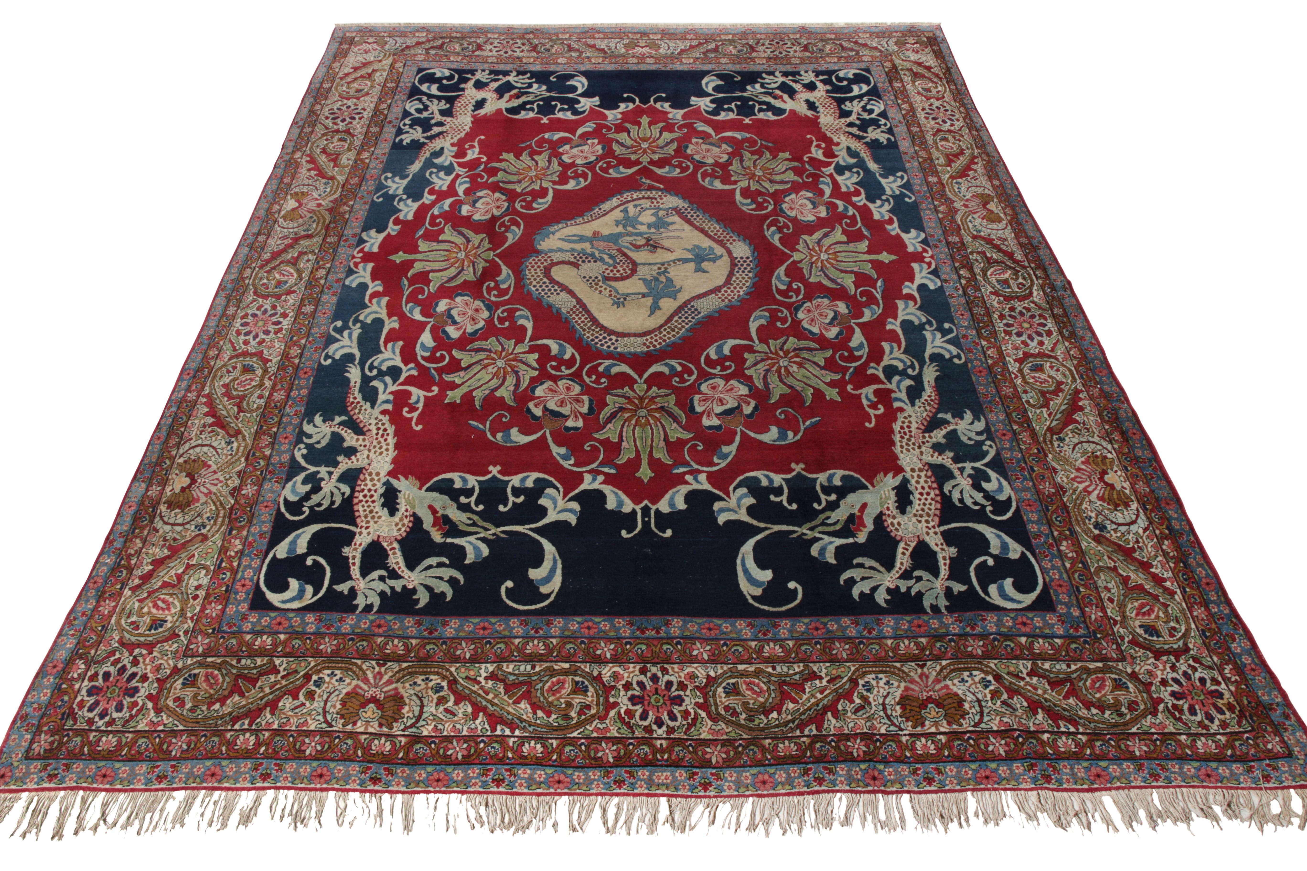 Originating from Persia circa 1910-1920, this antique 9x11 Kerman Lavar rug joins Rug & Kilim’s Antique & Vintage collection. This piece draws attention with its unique pictorial representation of dragons where one cocoons itself right in the middle