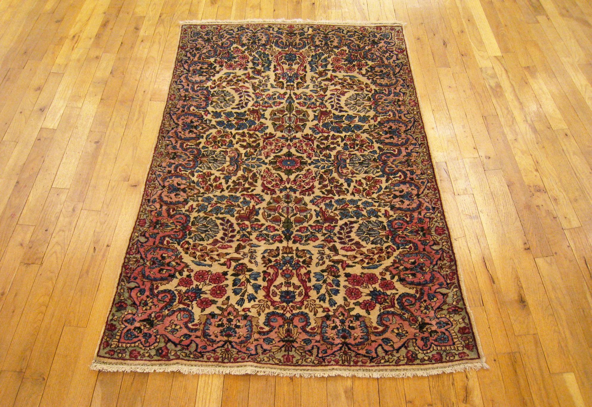 Hand-Woven Antique Persian Kerman Oriental Rug, in Small Size, with Ivory Field and Flowers