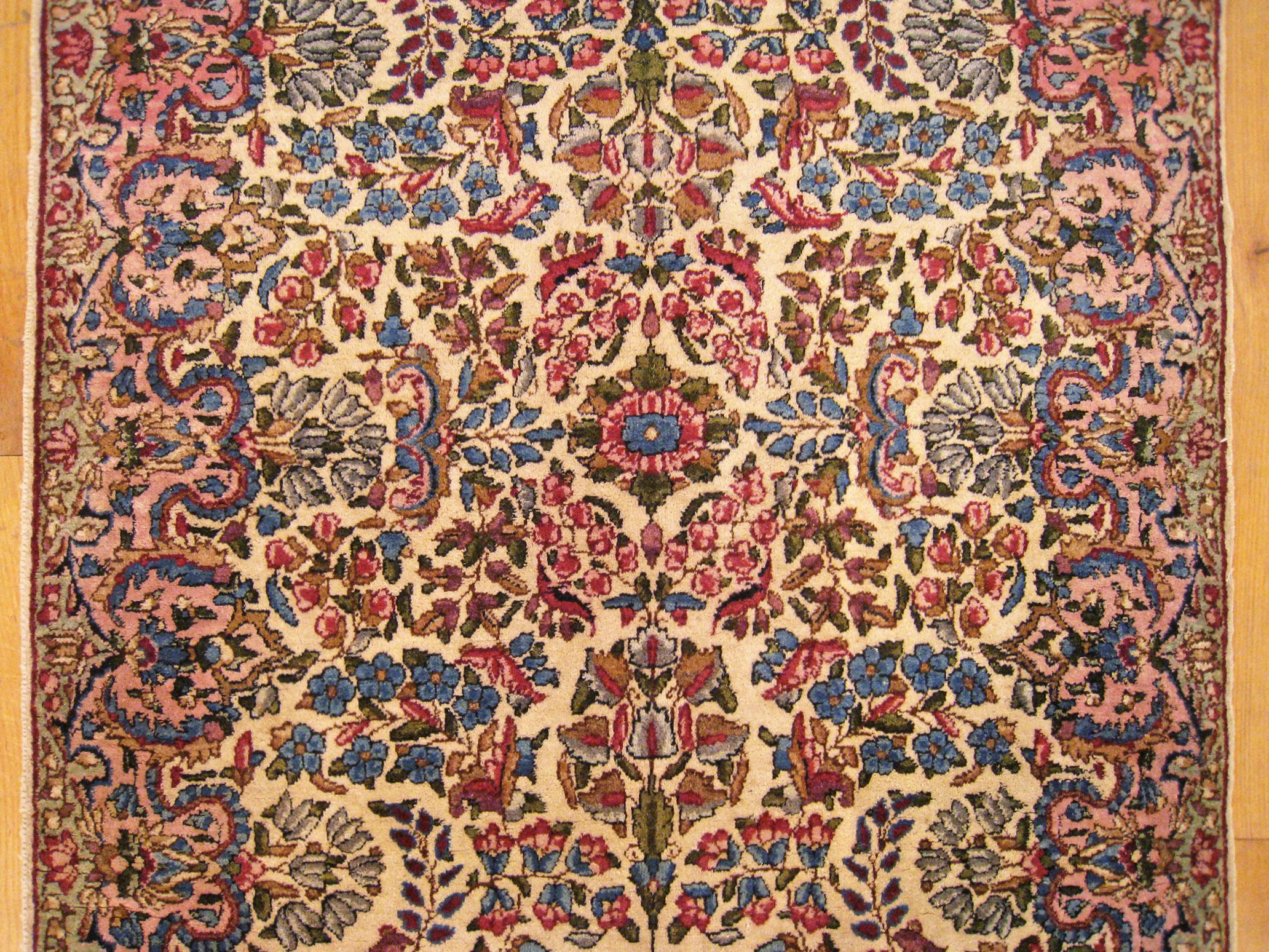 Early 20th Century Antique Persian Kerman Oriental Rug, in Small Size, with Ivory Field and Flowers