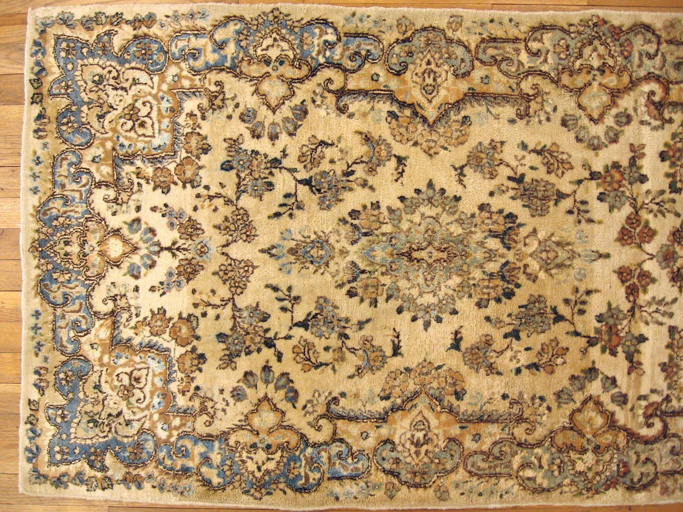 Wool Antique Persian Kerman Oriental Rug, Small Size, with Central Medallion For Sale