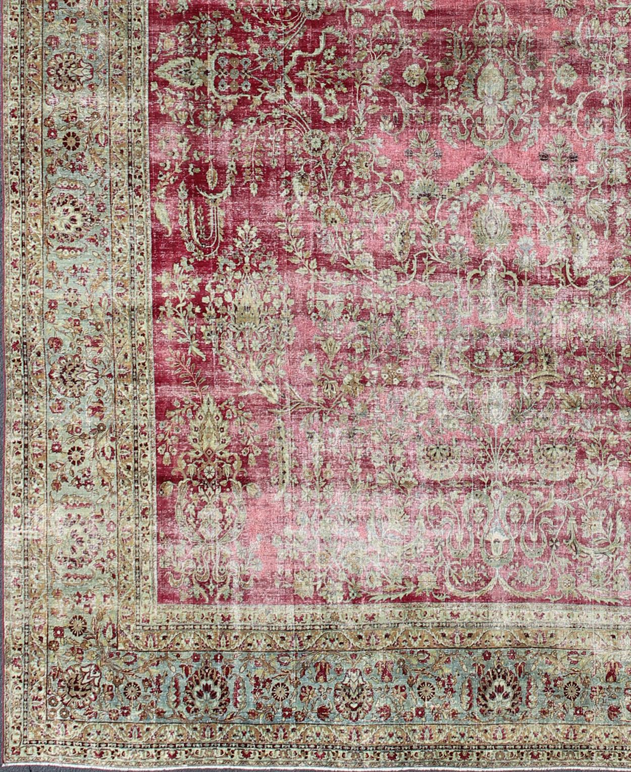 Distressed Antique Persian Lavar Kerman Rug in All-Over Intricate Floral Design. Keivan Woven Arts / rug B-0404, country of origin / type: Iran / Kerman , circa 1900. 
Measures: 12'9 x 17'2 
This magnificent antique Kerman carpet from 1900 is an