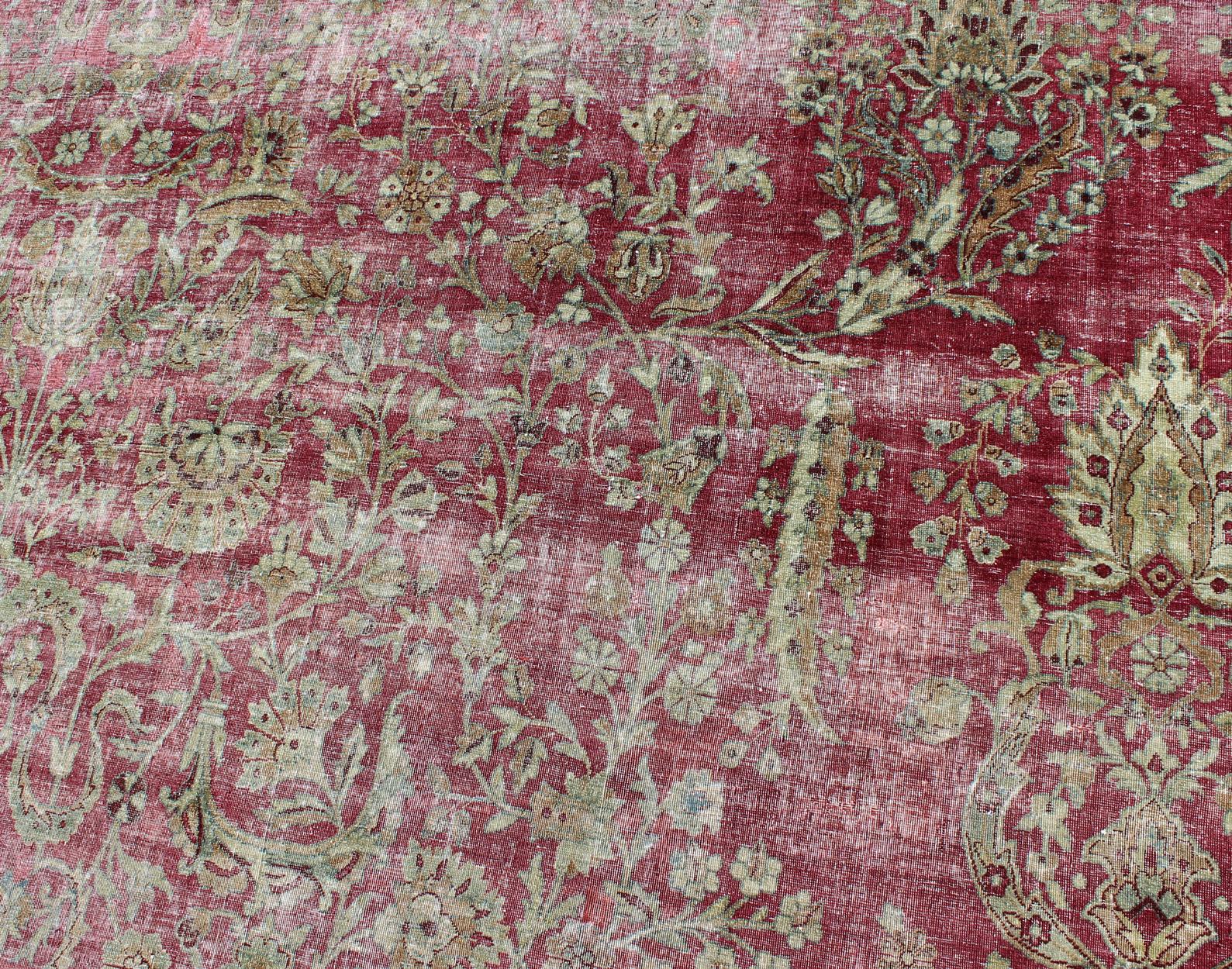 Wool Distressed Antique Persian Lavar Kerman Rug in All-Over Intricate Floral Design For Sale