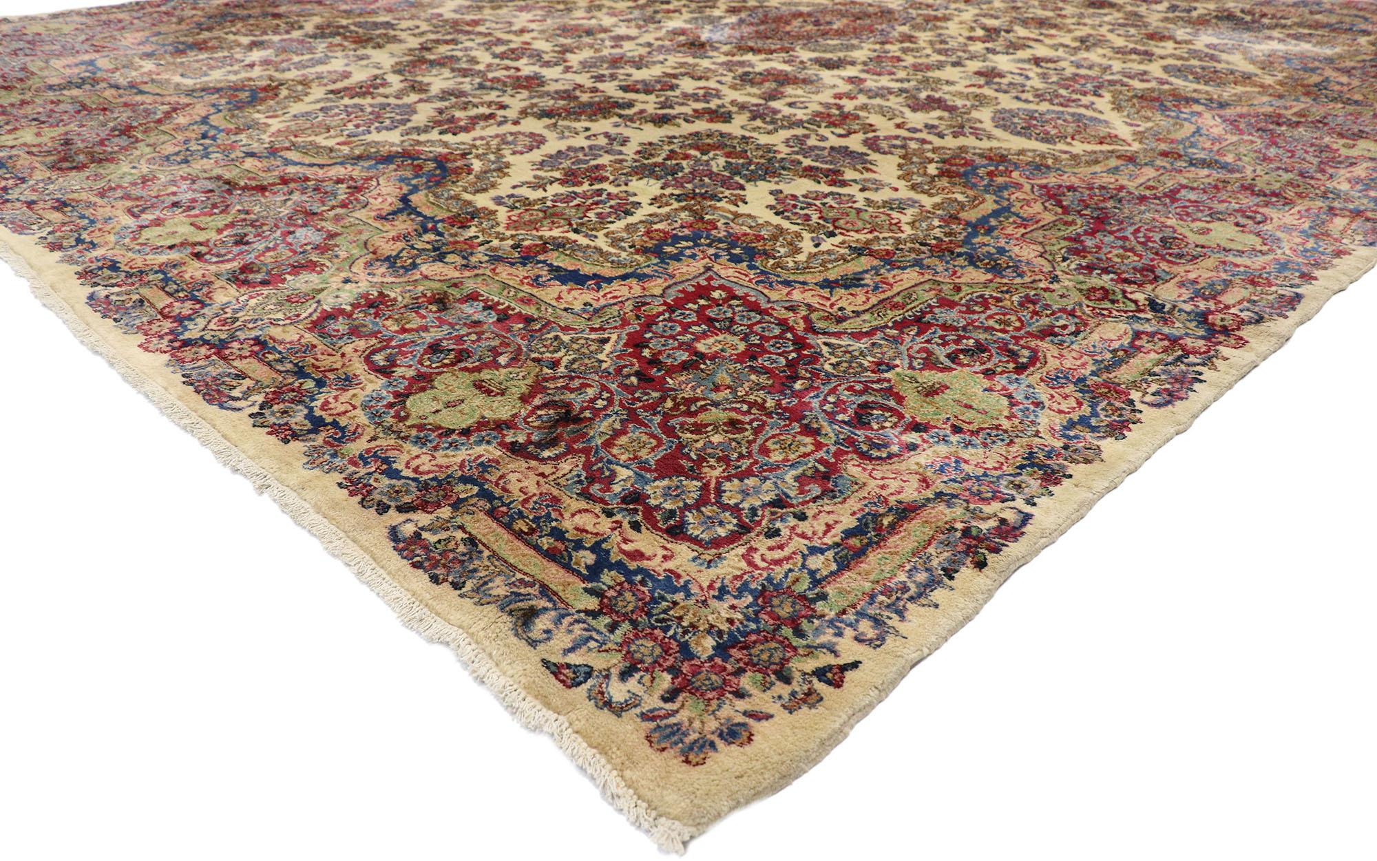 76758, antique Persian Kerman rug with French Victorian style, antique Kirman rug. With an impressive array of realistic floral elements and a refined color palette, this hand knotted wool antique Persian Kerman palace rug charms with ease and