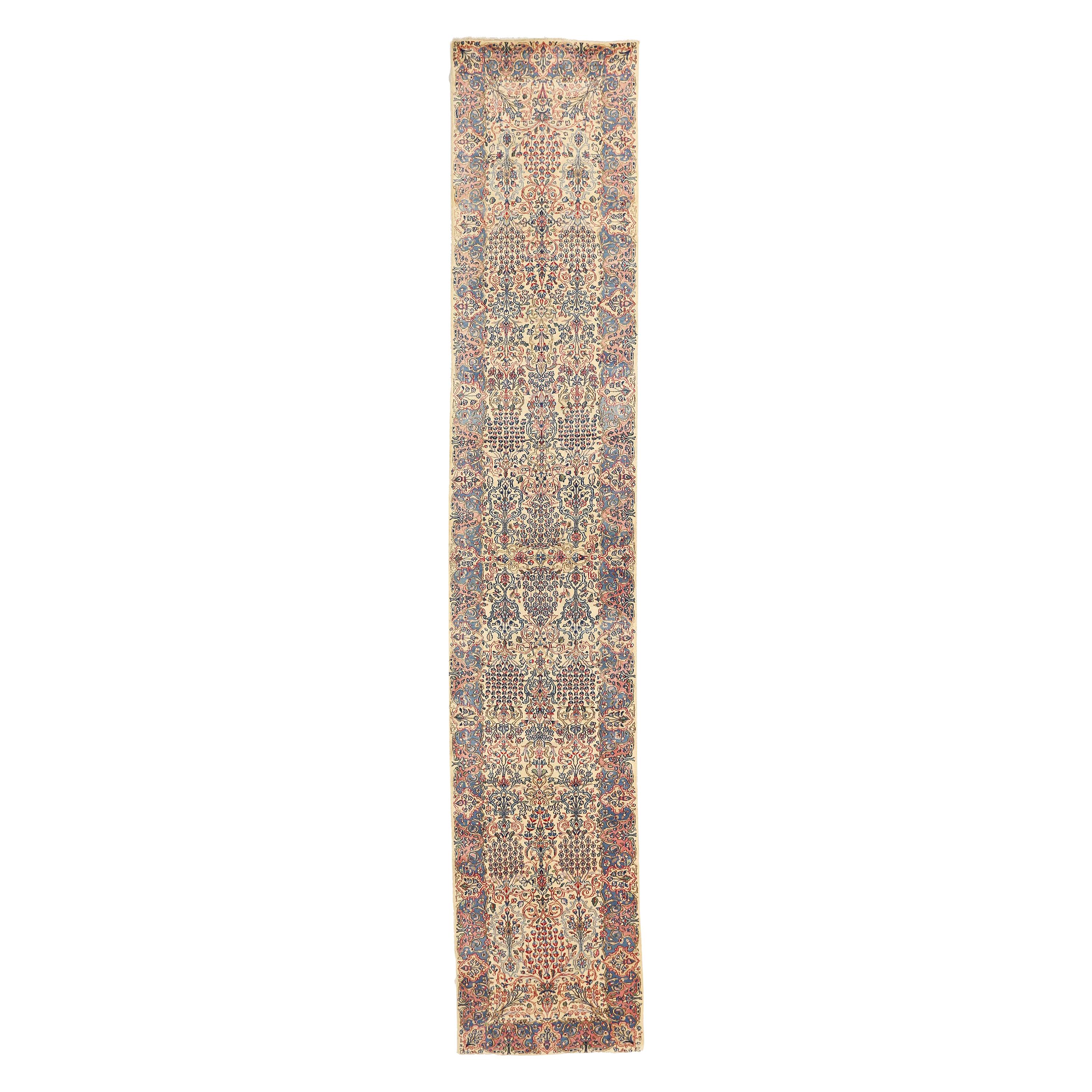 Antique Persian Kerman Runner Rug with Red & Blue Floral Motifs on Ivory Field For Sale
