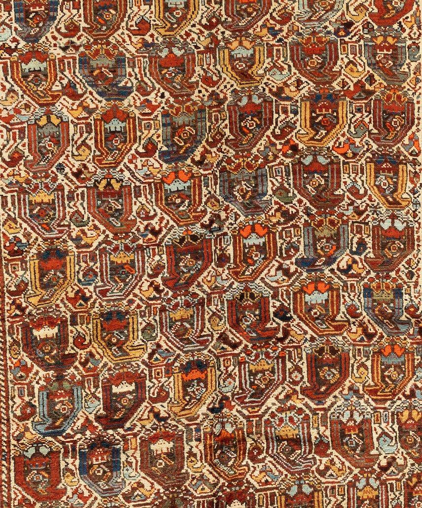 Khamseh rugs like this antique Khamseh Southwest Persian Bagface are greatly admired by rug experts for having fine craftsmanship and lustrous wool. Khamseh refers to a nomadic tribal group from Southwestern Iran. Similar to Qashqai, these rugs