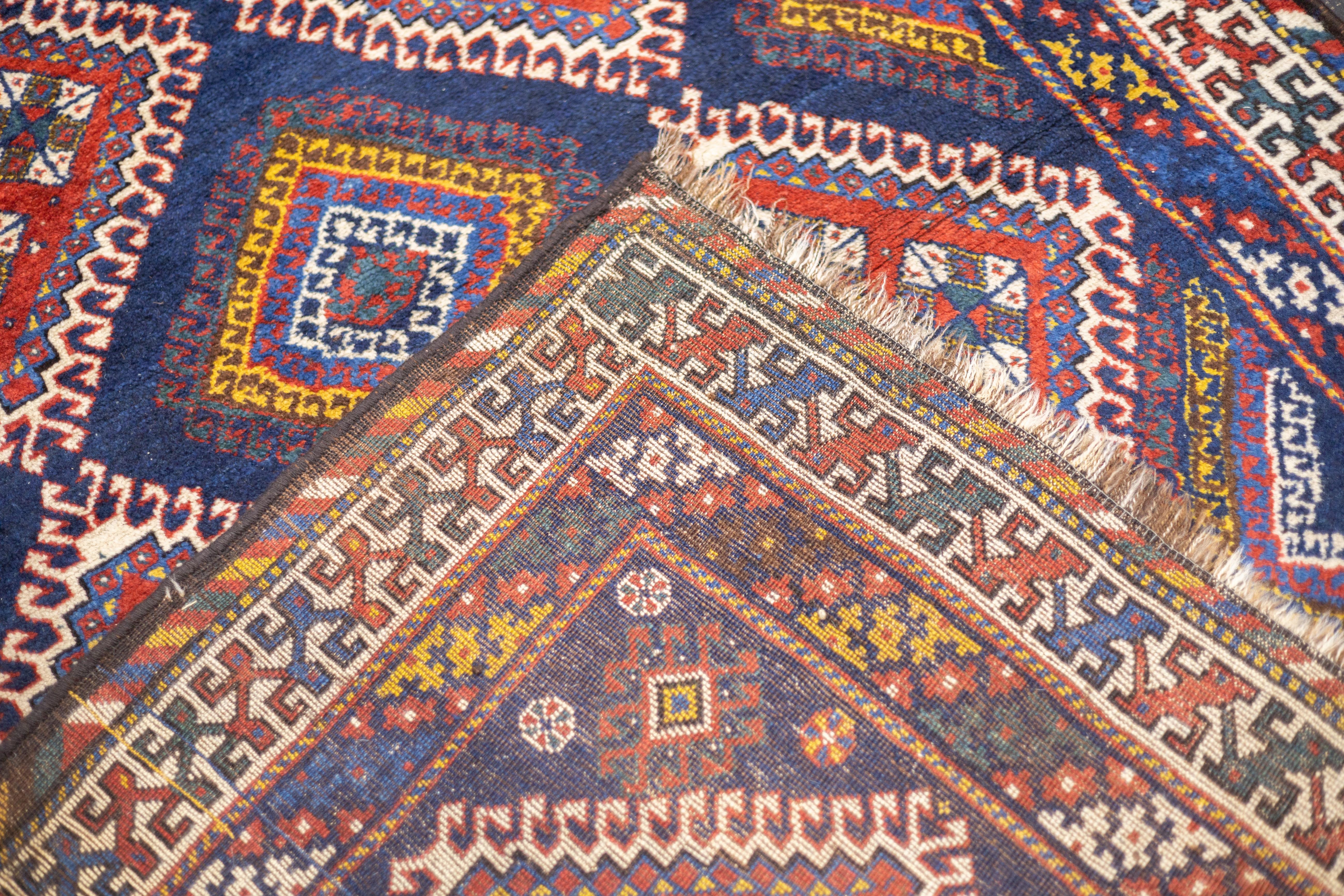 Antiker persischer Khamseh-Teppich 5'0