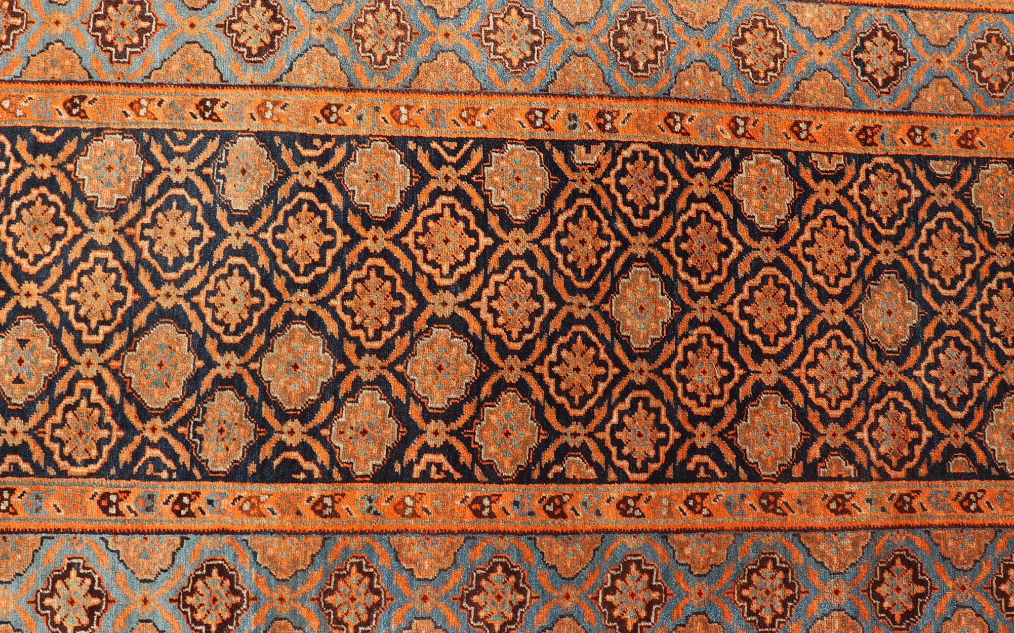Large antique Persian Khorasan rug with floral design in navy blue background, blue and orange rug PTA-21007, country of origin / type: Iran / Khorasan, circa 1910
Keivan Woven Arts

Measures: 2'9 x 14'2.