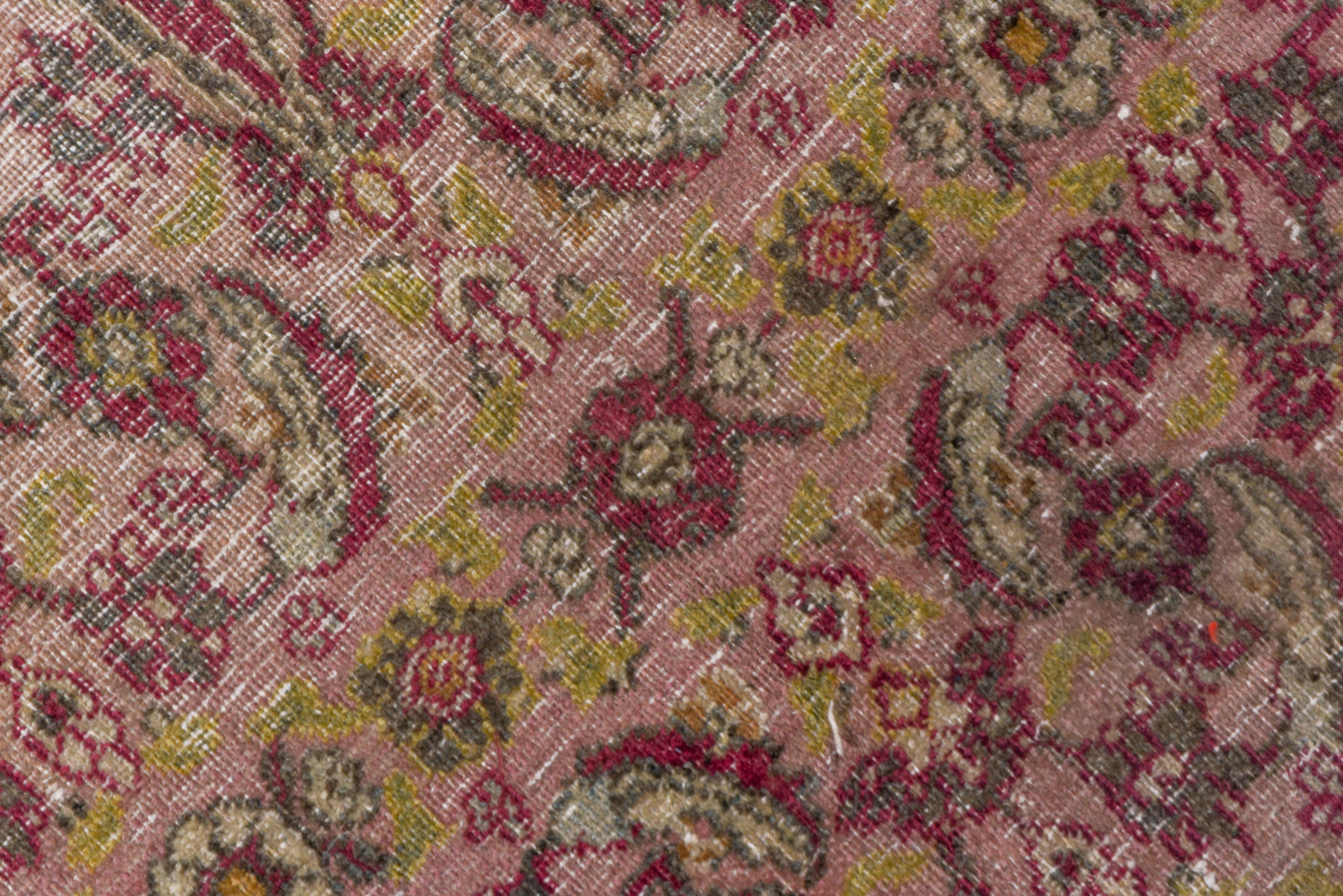 Early 20th Century Antique Persian Khorassan Rug, Dusty Pink Field, Wine, Citron & Green Accents For Sale