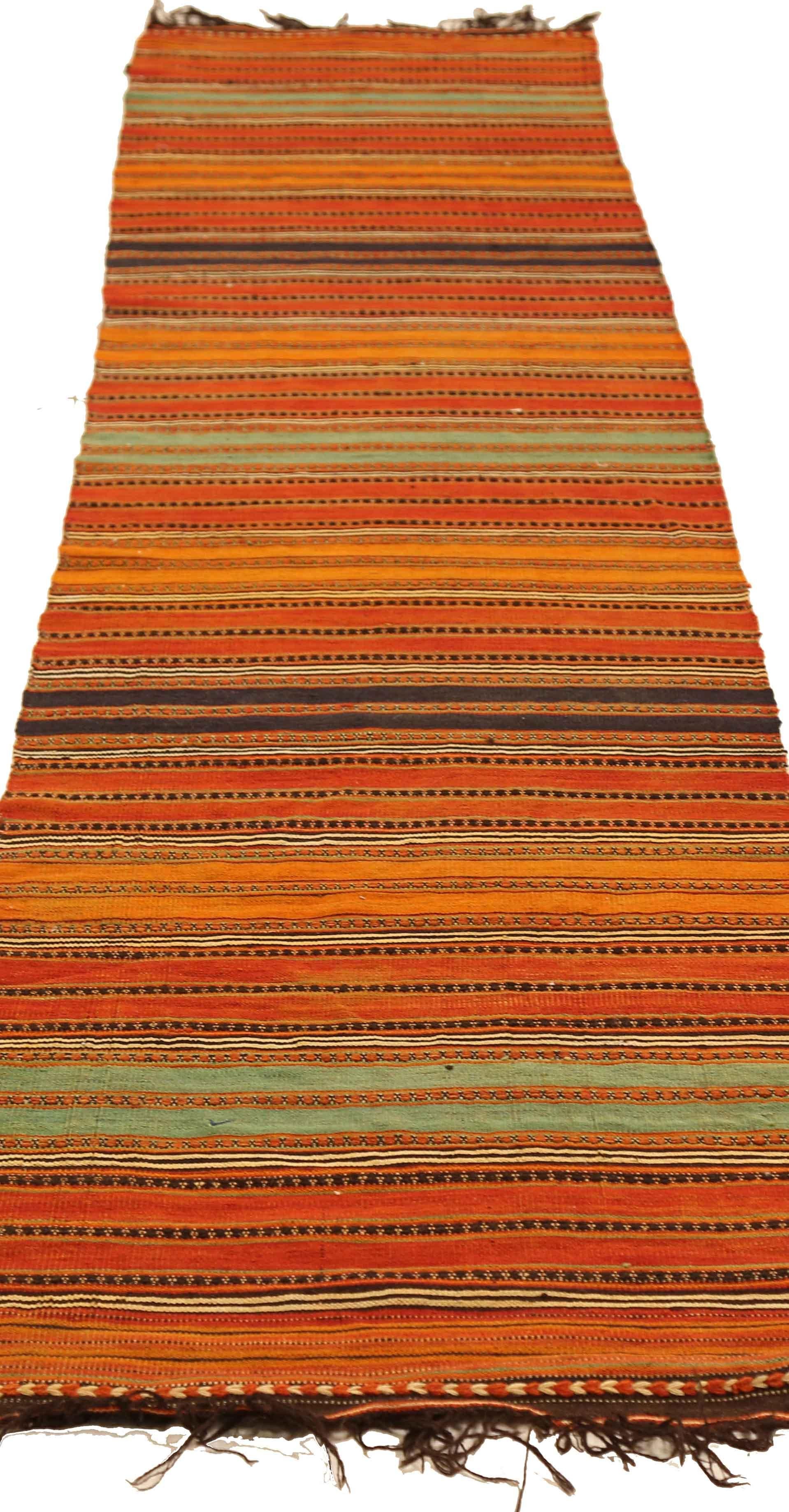 Antique handmade Persian runner rug from high quality sheep’s wool and colored with eco-friendly vegetable dyes that are proven safe for humans and pets alike. It’s a Classic Kilim design showcasing vibrant colored stripes. It’s a lovely piece that