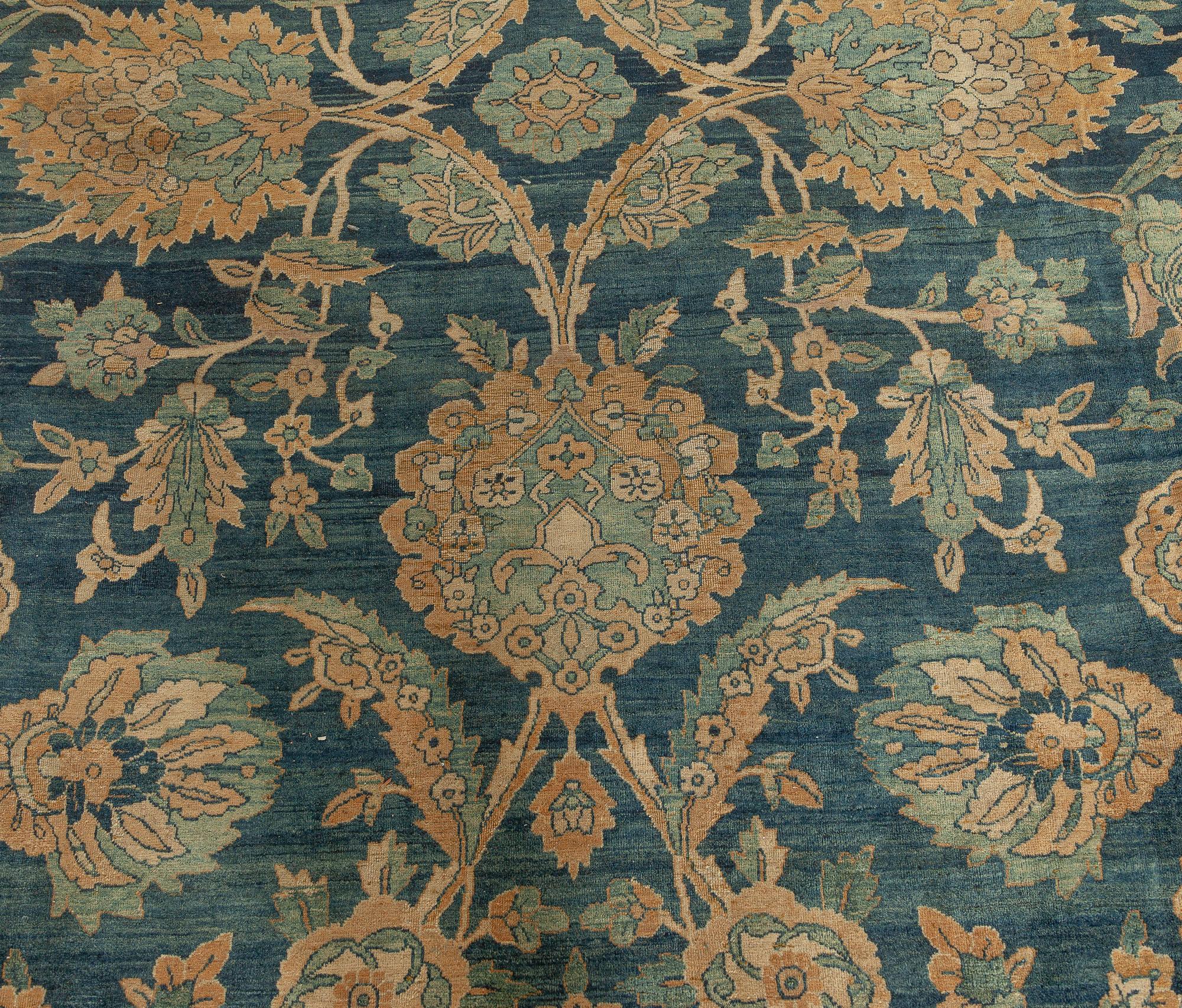 Fine Antique Persian Kirman midnight blue handmade wool rug
Size: 11'0