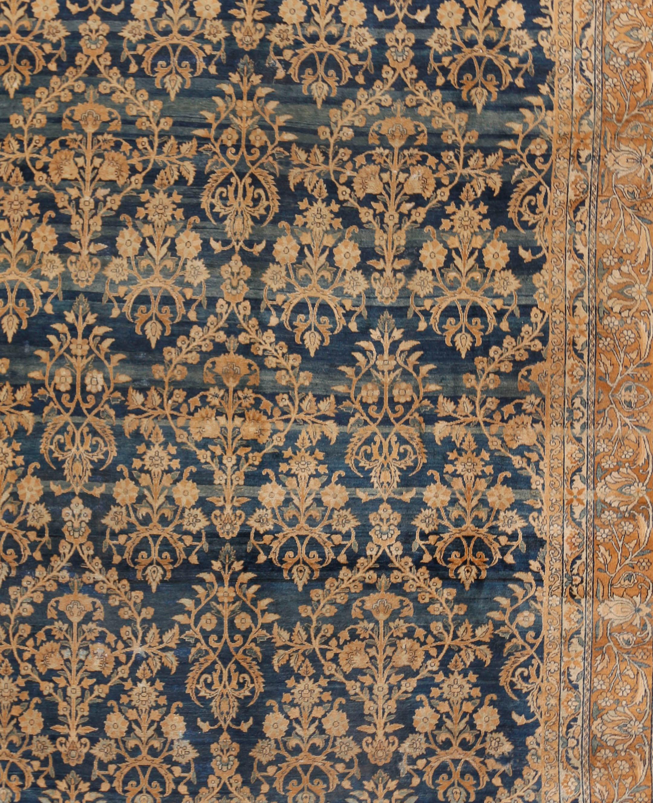 Antique Persian Kirman rug, circa 1900, 9'4 x 12'10. A wonderful antique circa 1900 Kirman rug in tones of blue with an abrash in the blues. An abrash is a natural change in color that occurs when different dyes are used and is very common in