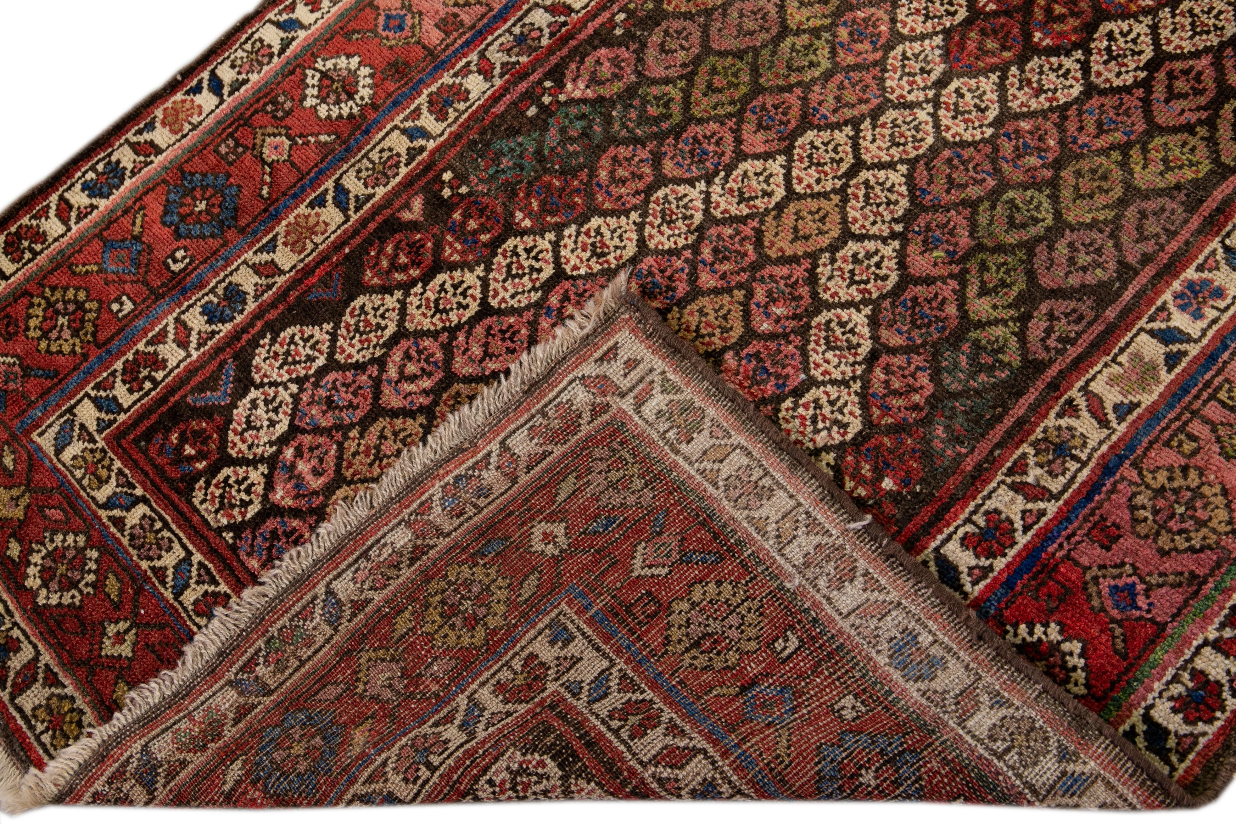 A 20th century antique Persian Kurd rug with an all-over multicolored geometric motif. This piece has fine details, great colors, and a beautiful design.

This rug measures 3'3