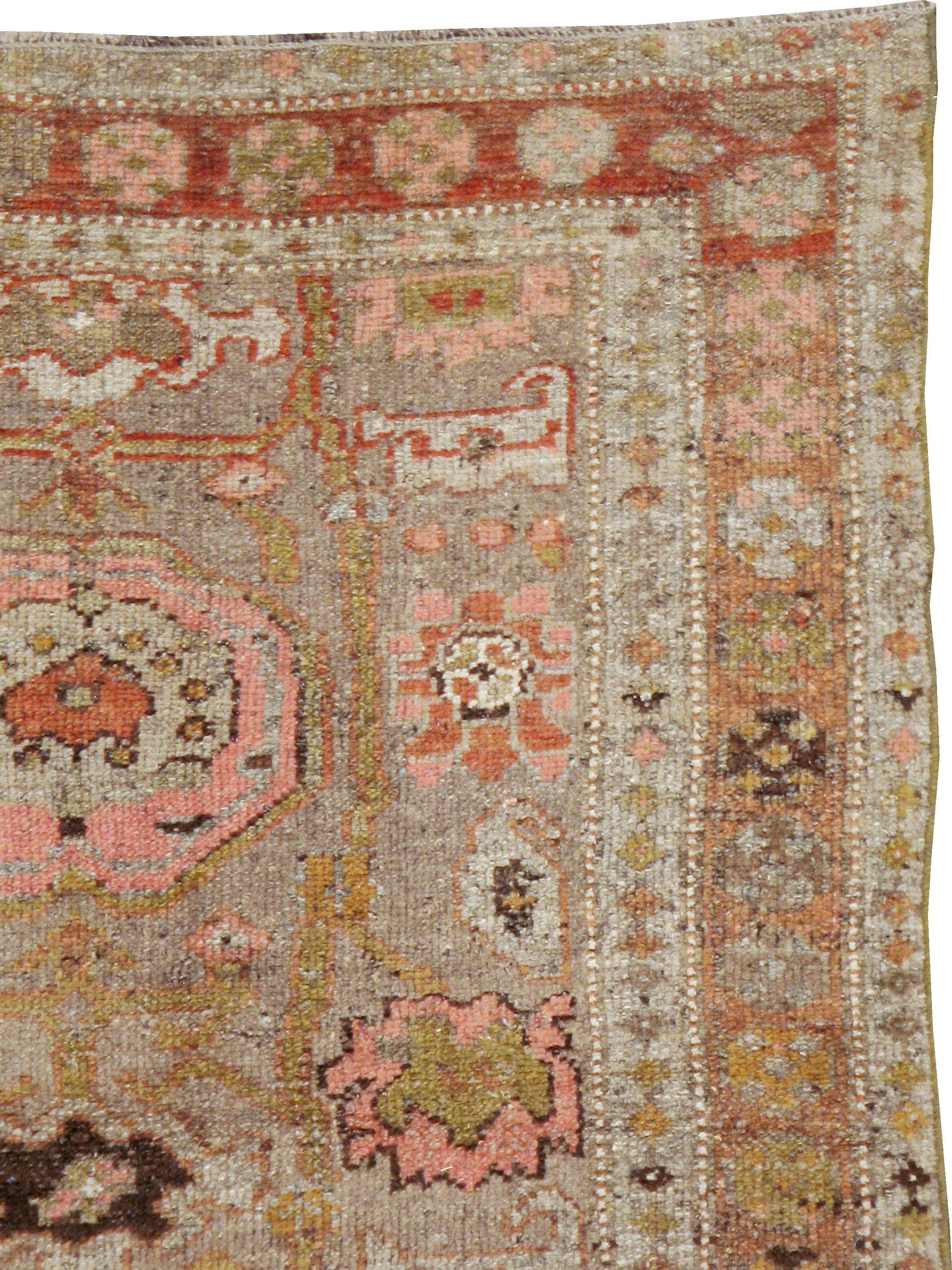 An antique Persian Kurdish rug from the turn of the 20th century.