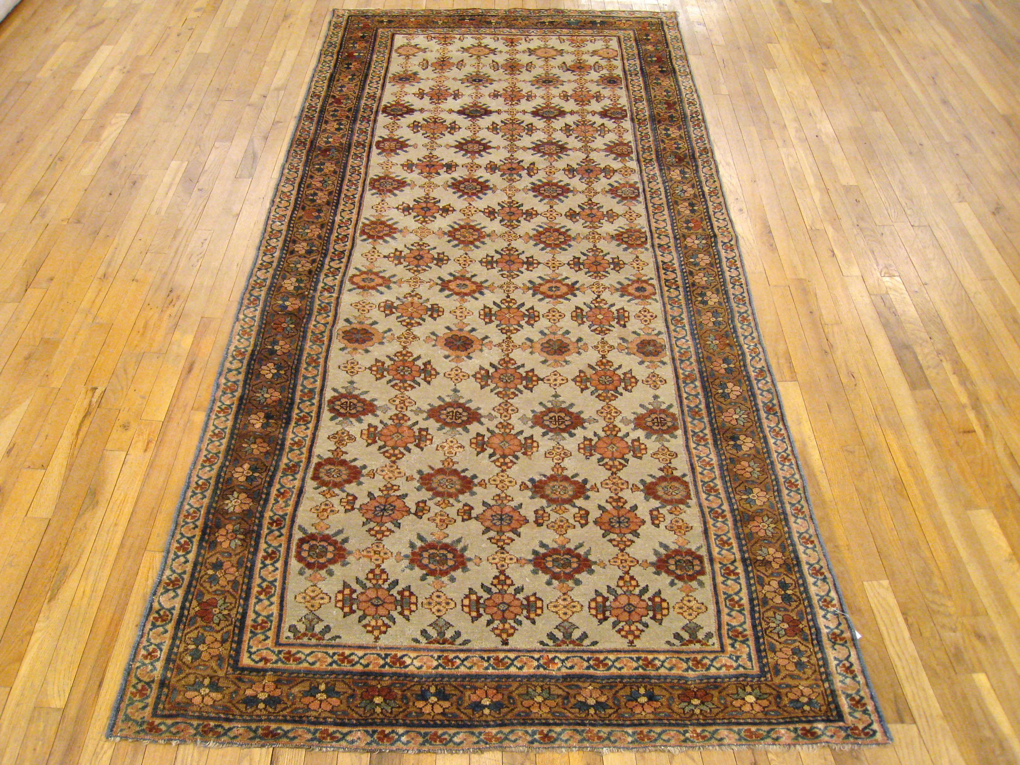 Hand-Knotted Antique Persian Kurd Rug, Gallery Size, Repeating Rosettes in Soft Tones For Sale