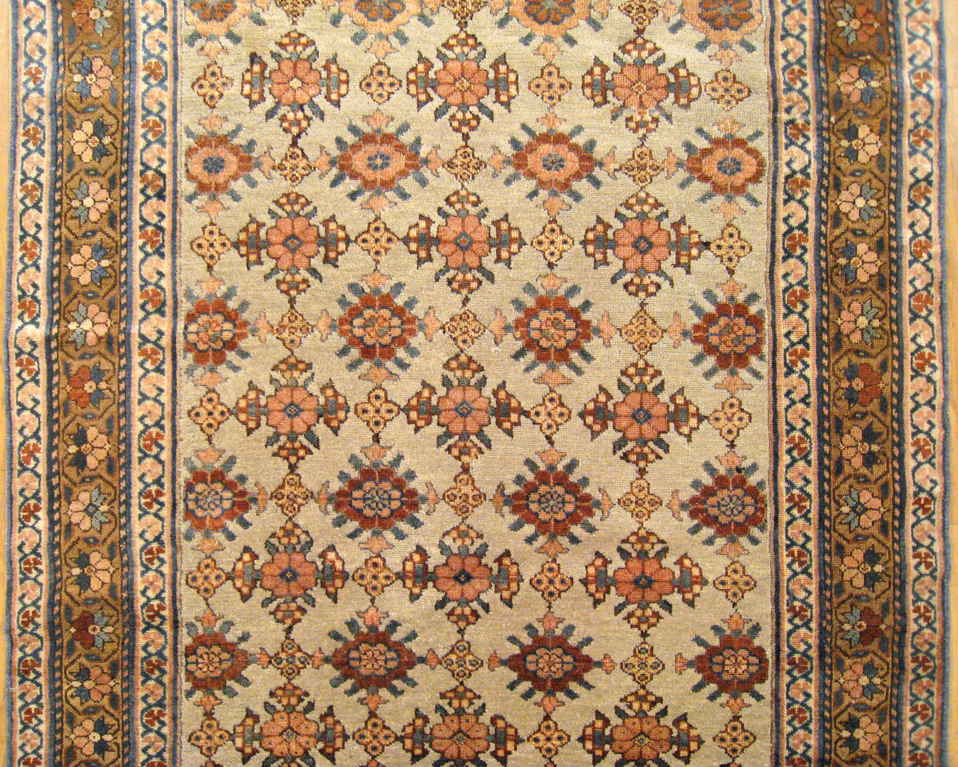 Early 20th Century Antique Persian Kurd Rug, Gallery Size, Repeating Rosettes in Soft Tones For Sale