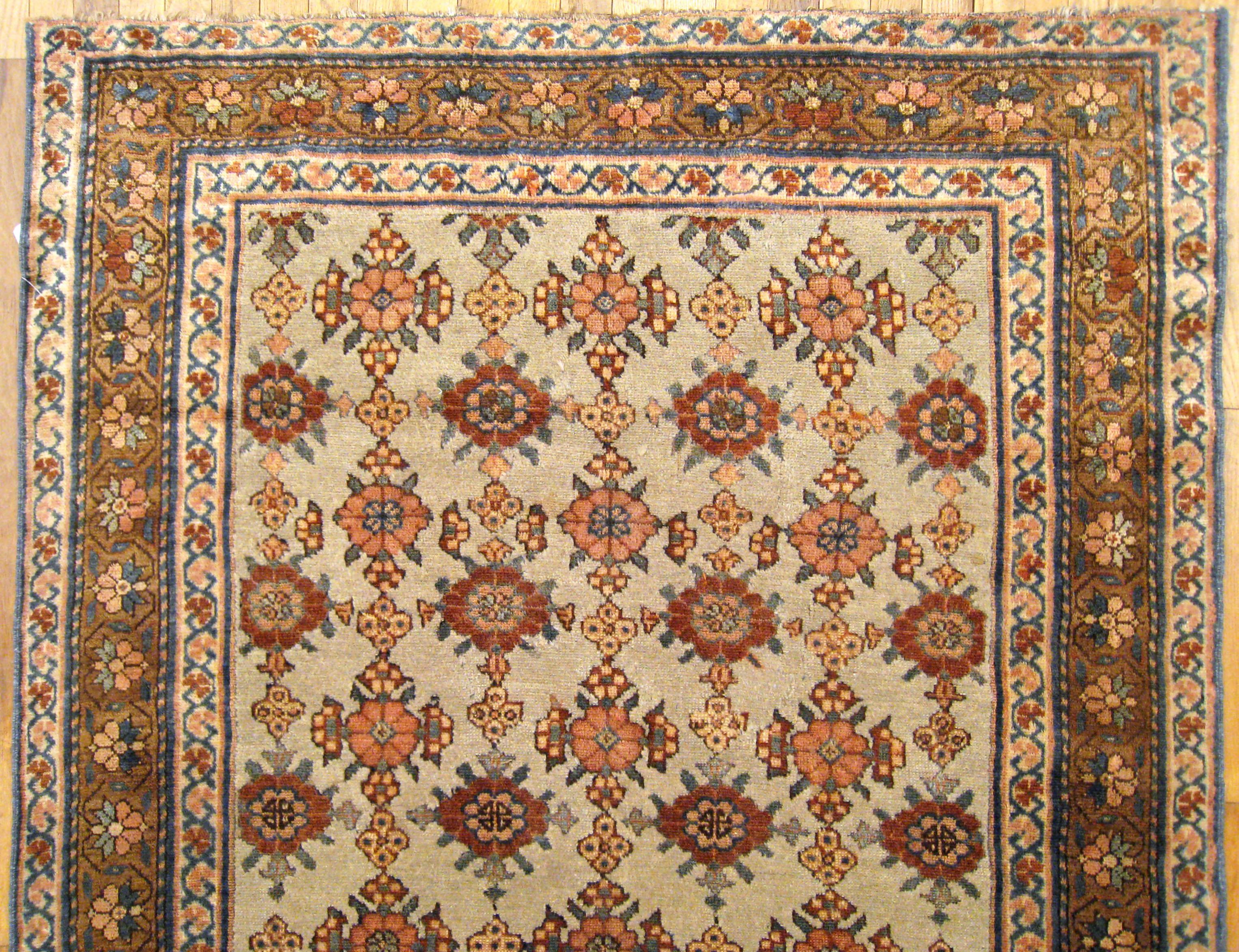 Wool Antique Persian Kurd Rug, Gallery Size, Repeating Rosettes in Soft Tones For Sale
