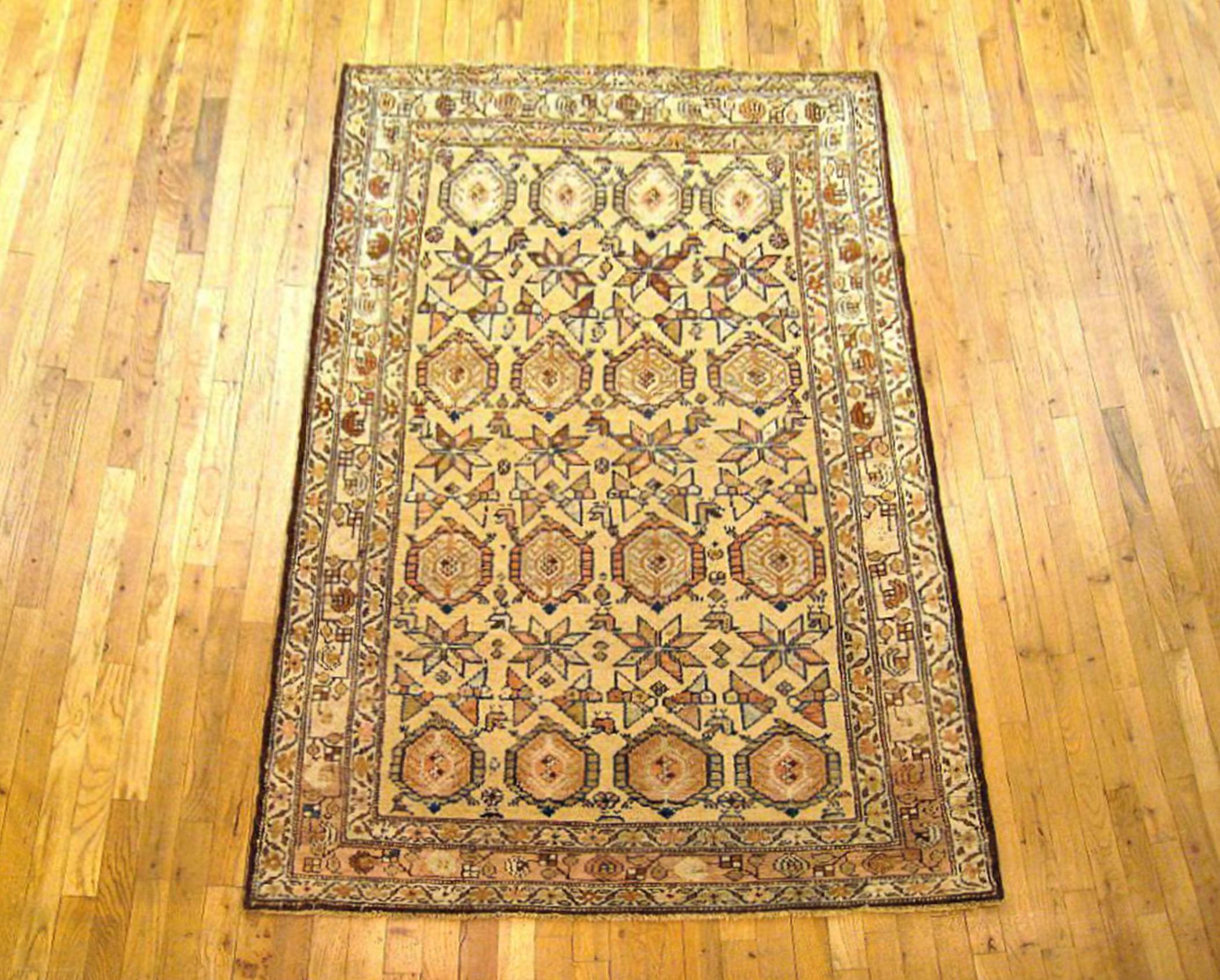 Antique Persian Kurd Rug, Small size, circa 1900

A one-of-a-kind antique Persian Kurd Oriental Carpet,  hand-knotted with soft wool pile. This rug features a Paisley design allover the light blue primary field, with a brown outer border. In small