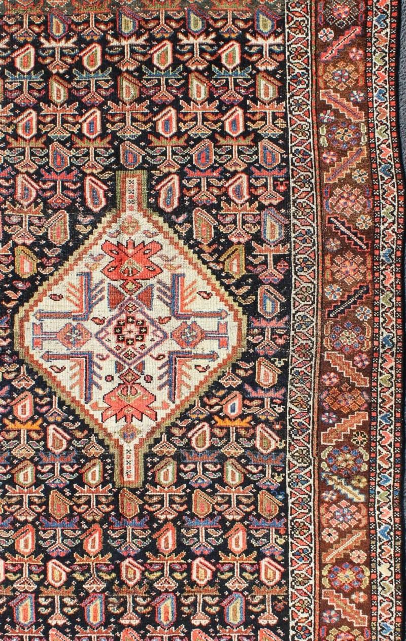 Hand-Knotted Antique Persian Kurdish Colorful Rug with Medallion and Geometric Motifs For Sale