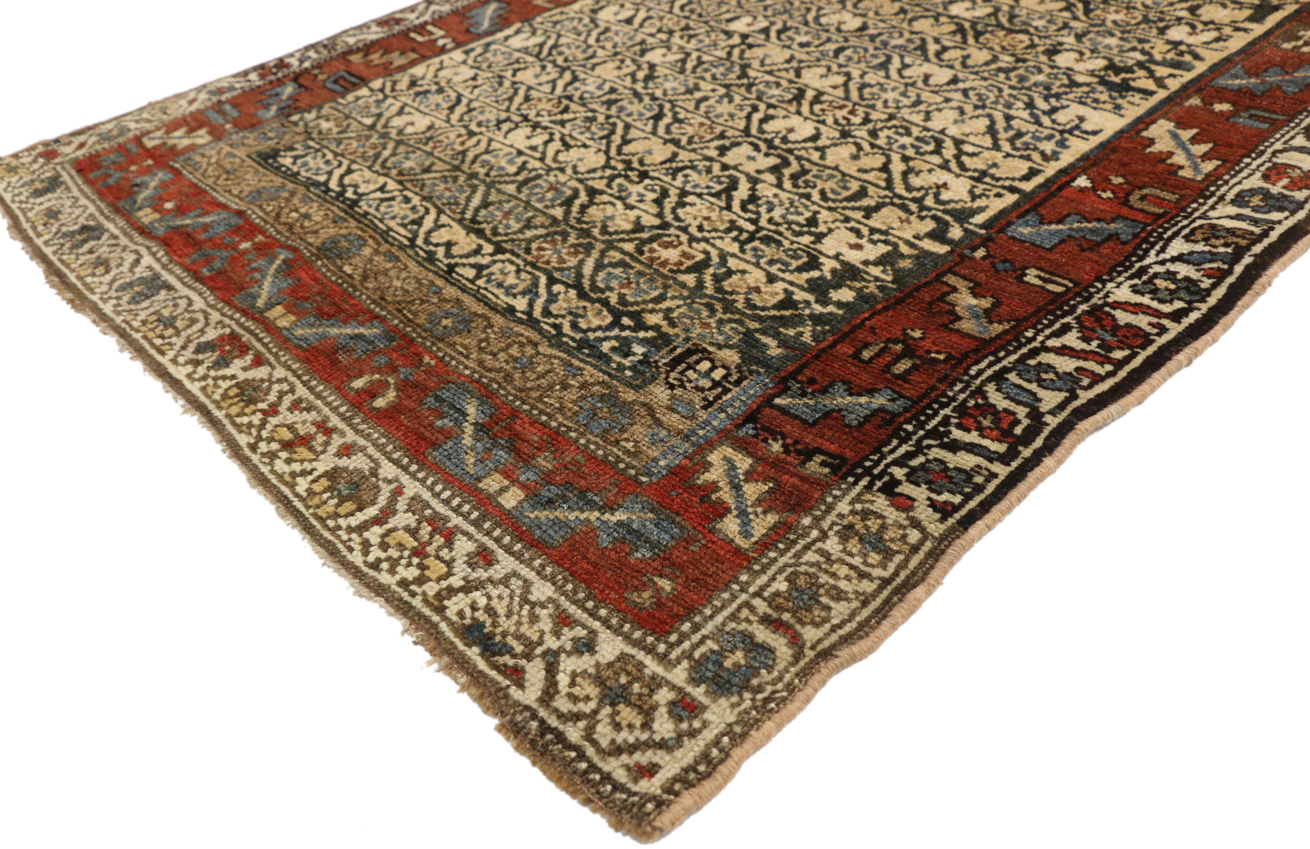 77278, antique Persian Kurdish hallway runner with artisan Arts & Crafts style. This hand knotted wool antique Persian Kurdish hallway runner features horizontal rows of carnation meander stripes. It is finished with a leaf and calyx style (wine