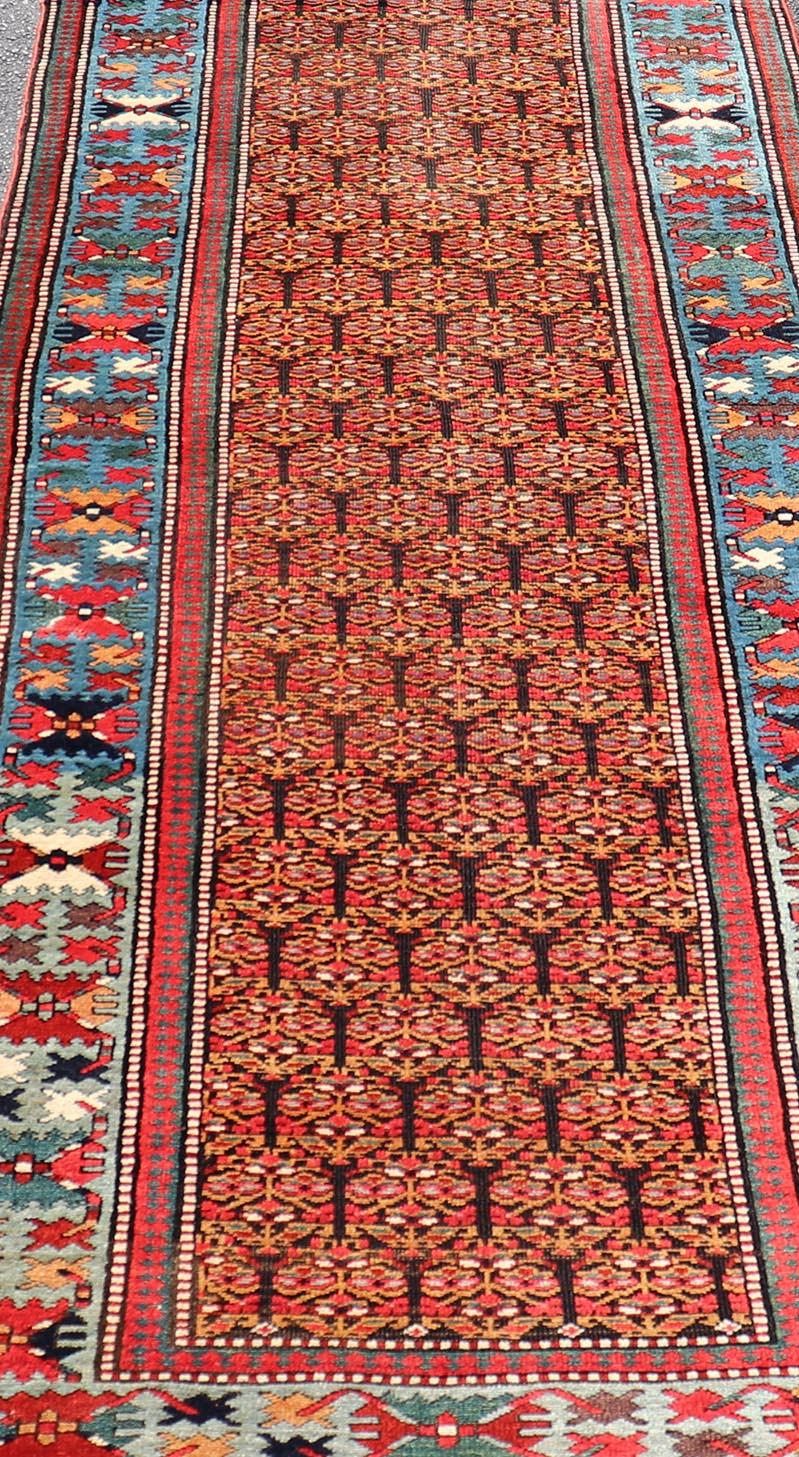 Antique Persian Kurdish Long Gallery Runner with Repeating Tribal Motif Design For Sale 6
